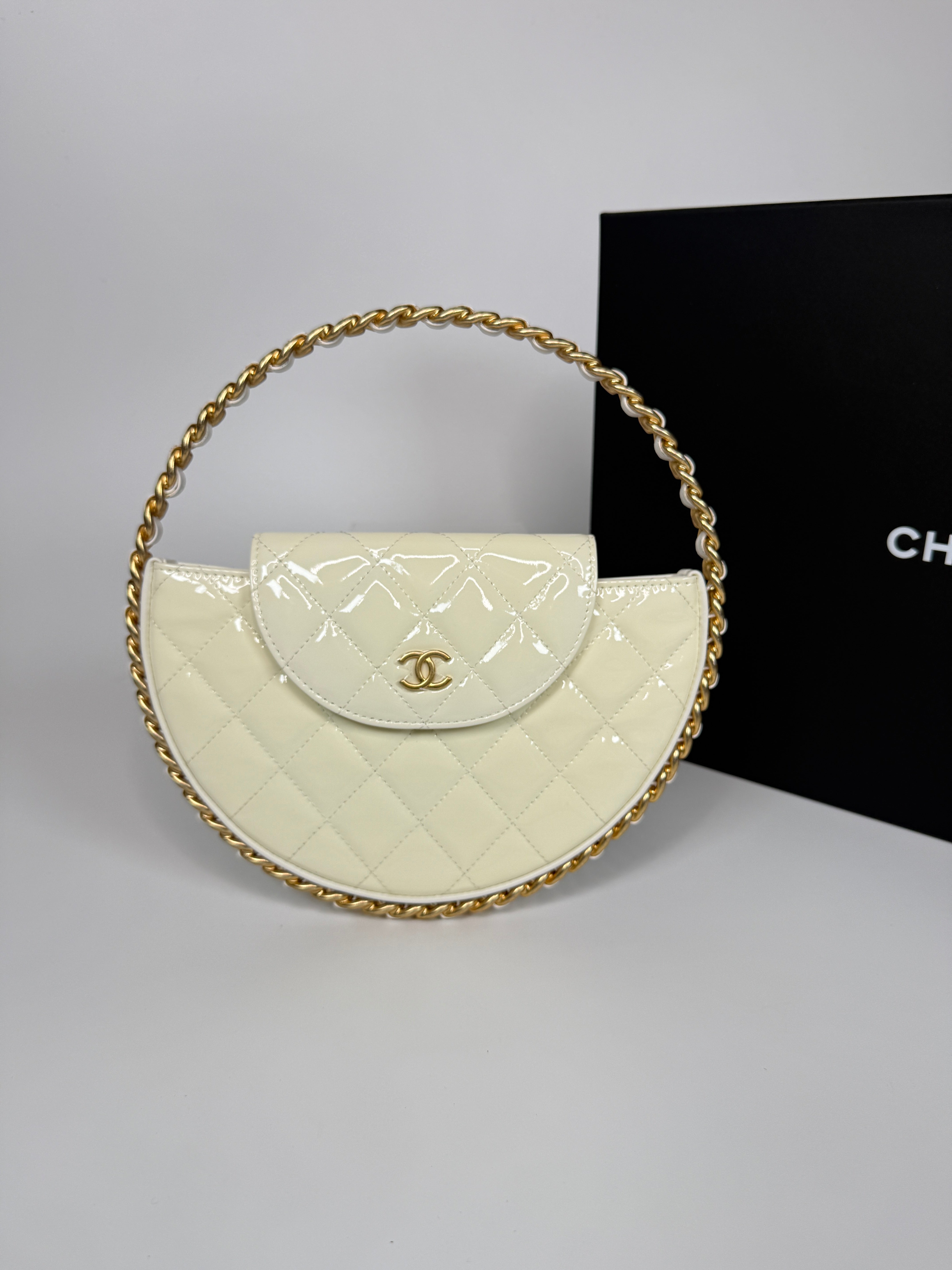 Authentic and preloved Chanel White Quilted Patent Leather Chain Around Hoop Bag In Excellent condition. 100% Authenticity Guarantee