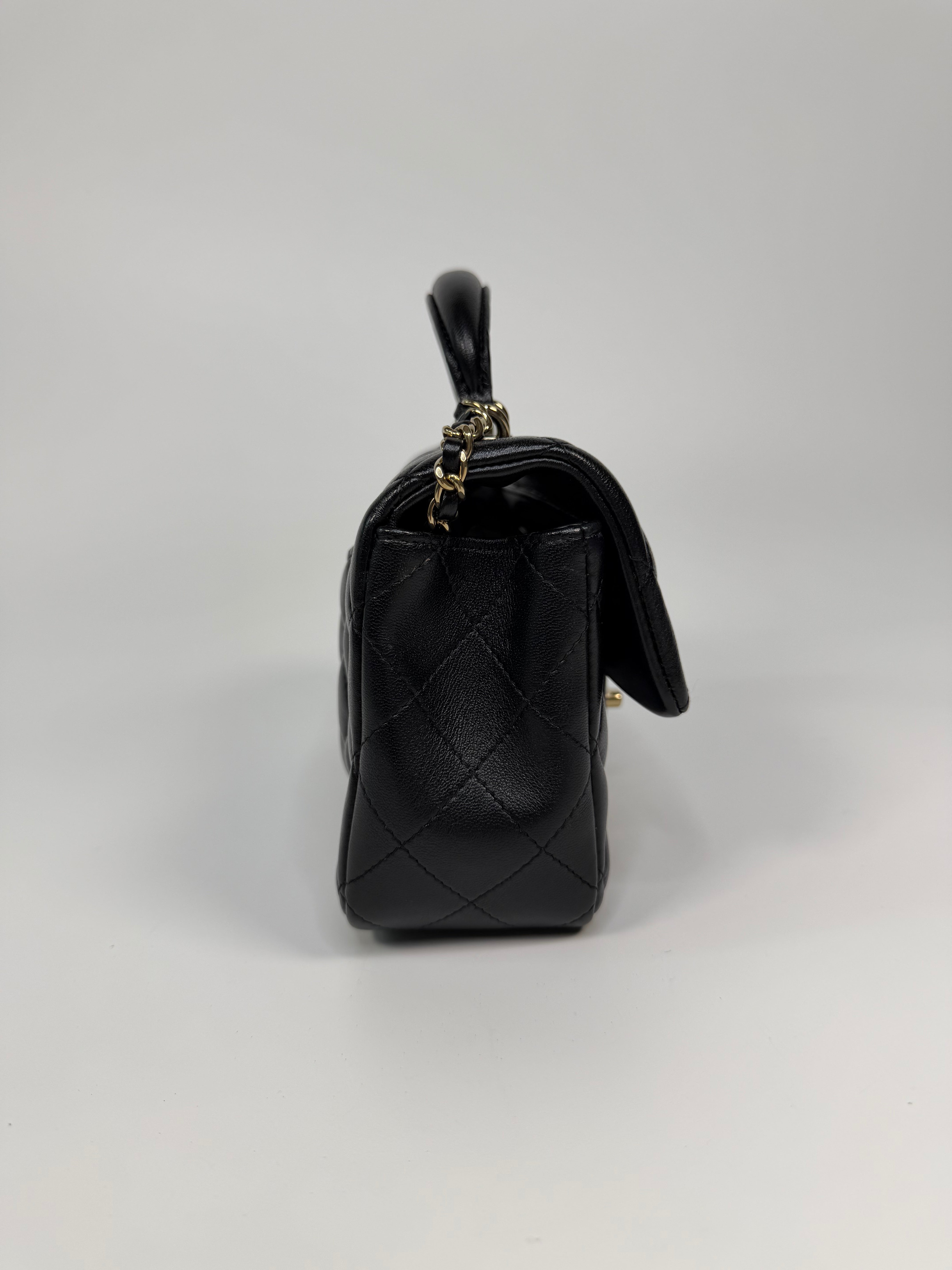 Chanel Mini Rectangle Top Handle In Black Lambskin Leather With Pale Gold Hardware. Authentic and preloved in excellent condition.