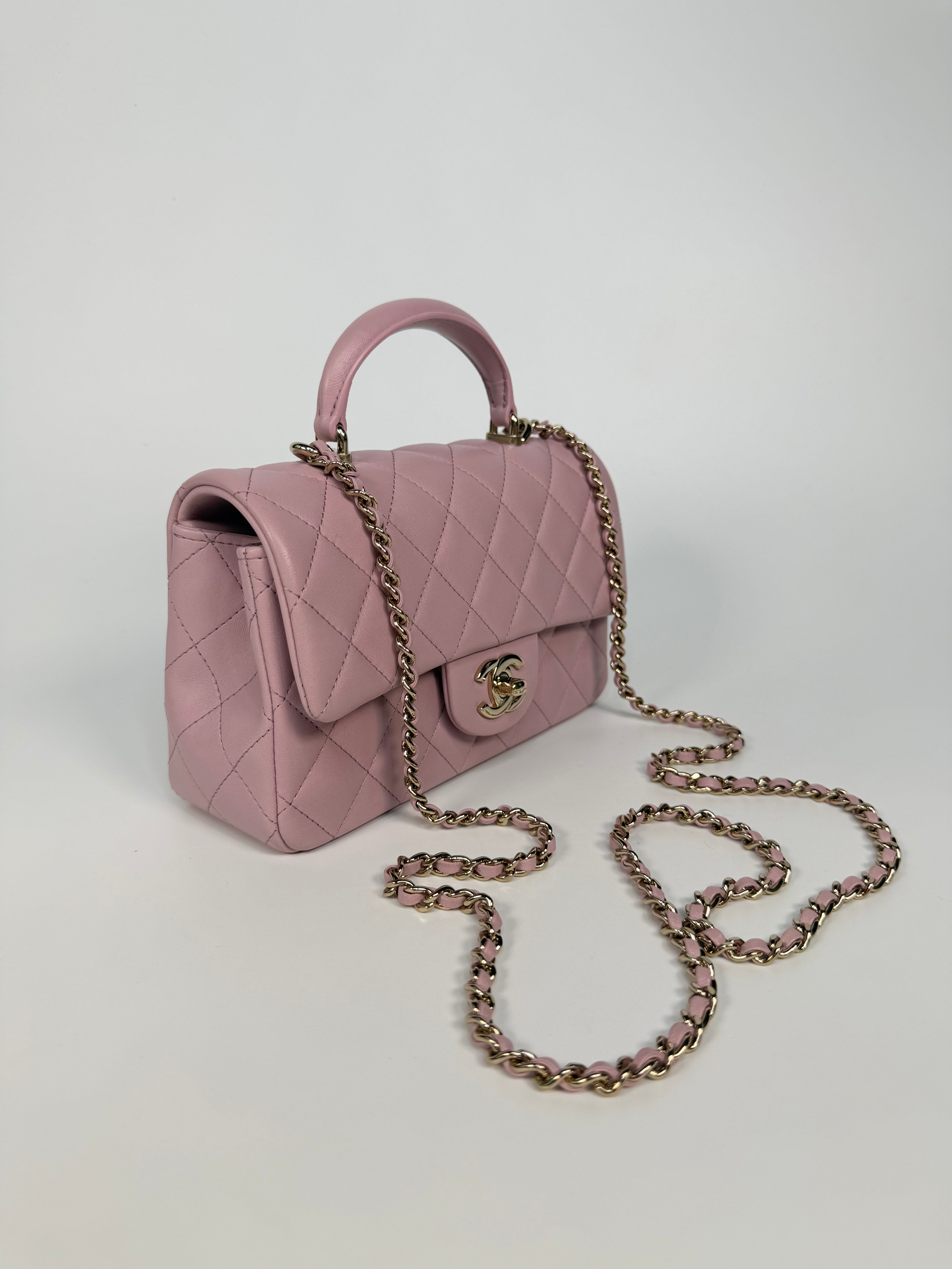 Chanel Mini Rectangle Top Handle In Pink Lambskin Leather With Pale Gold Hardware. 100% authentic and preloved in excellent condition