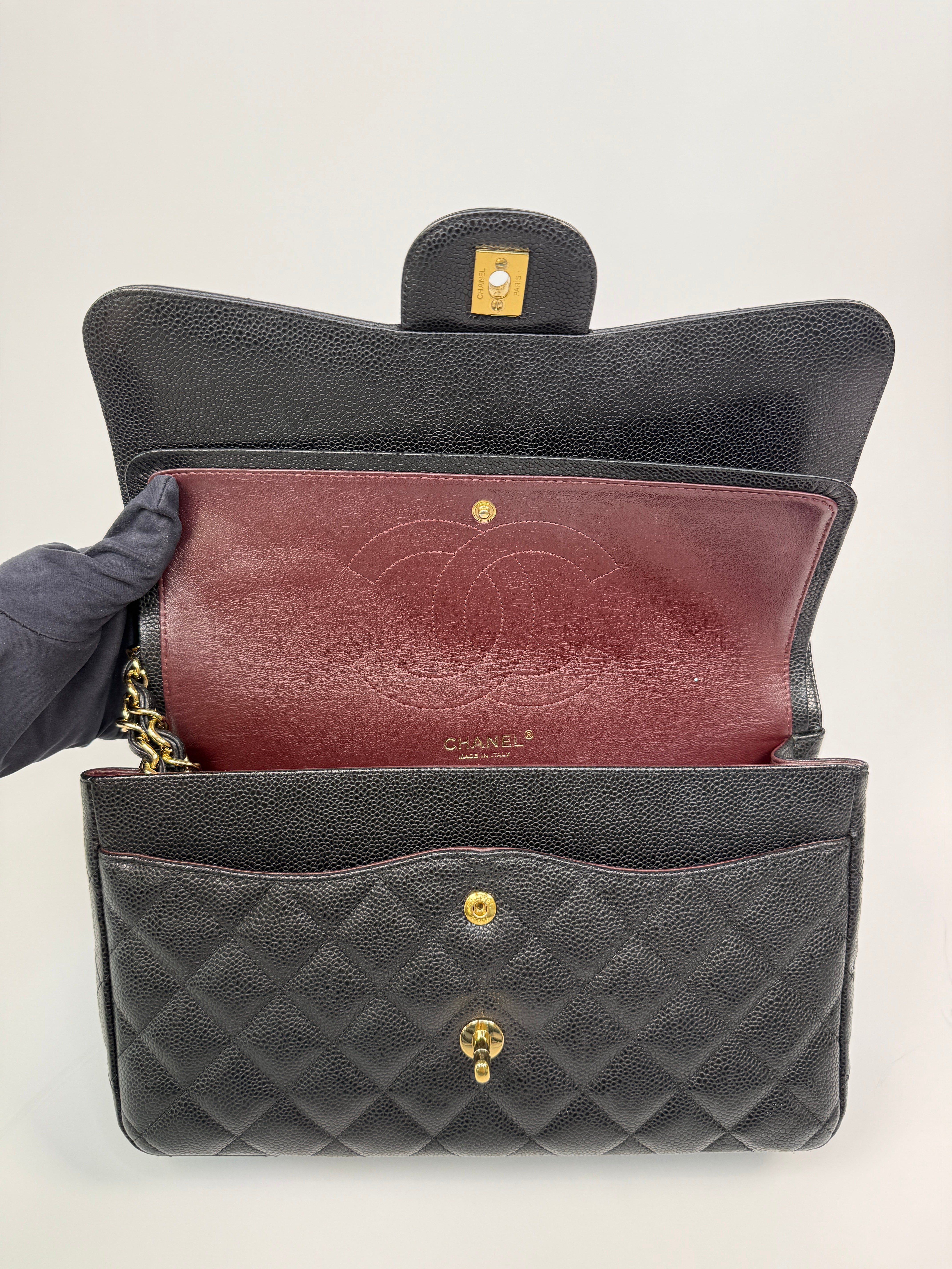 Chanel Classic Jumbo Flap Bag In Black Caviar LeatherWith Gold Hardware
Pre Loved & Authentic