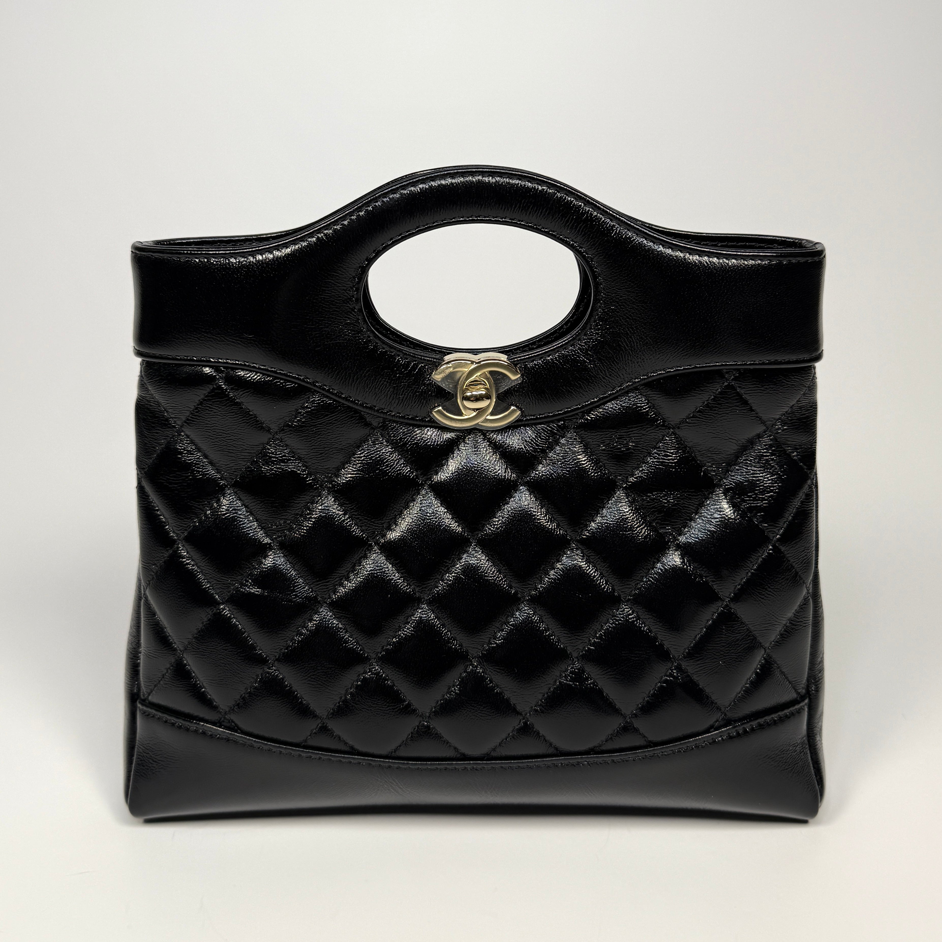 Chanel 31 Small In Black Calfskin With Pale Gold Hardware. Excellent Condition. Authentic and preloved.