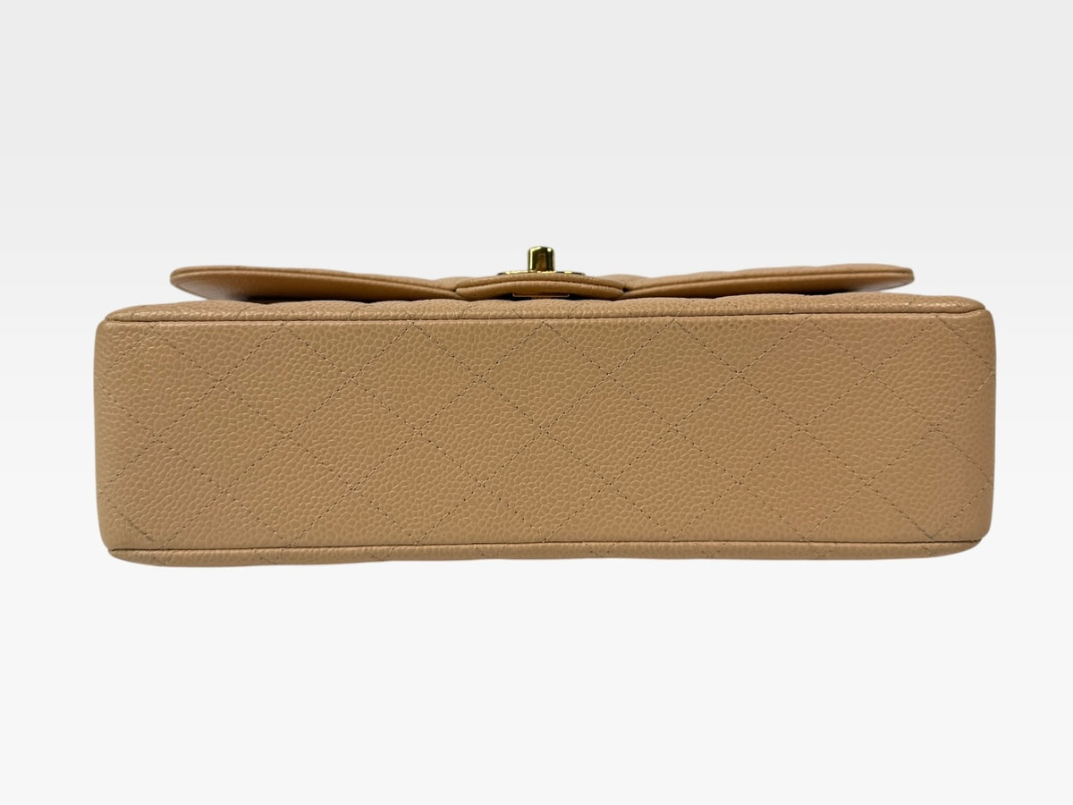 Chanel Medium Classic Flap In Beige Caviar Leather With Gold Hardware. 100% authentic and preloved in excellent condition