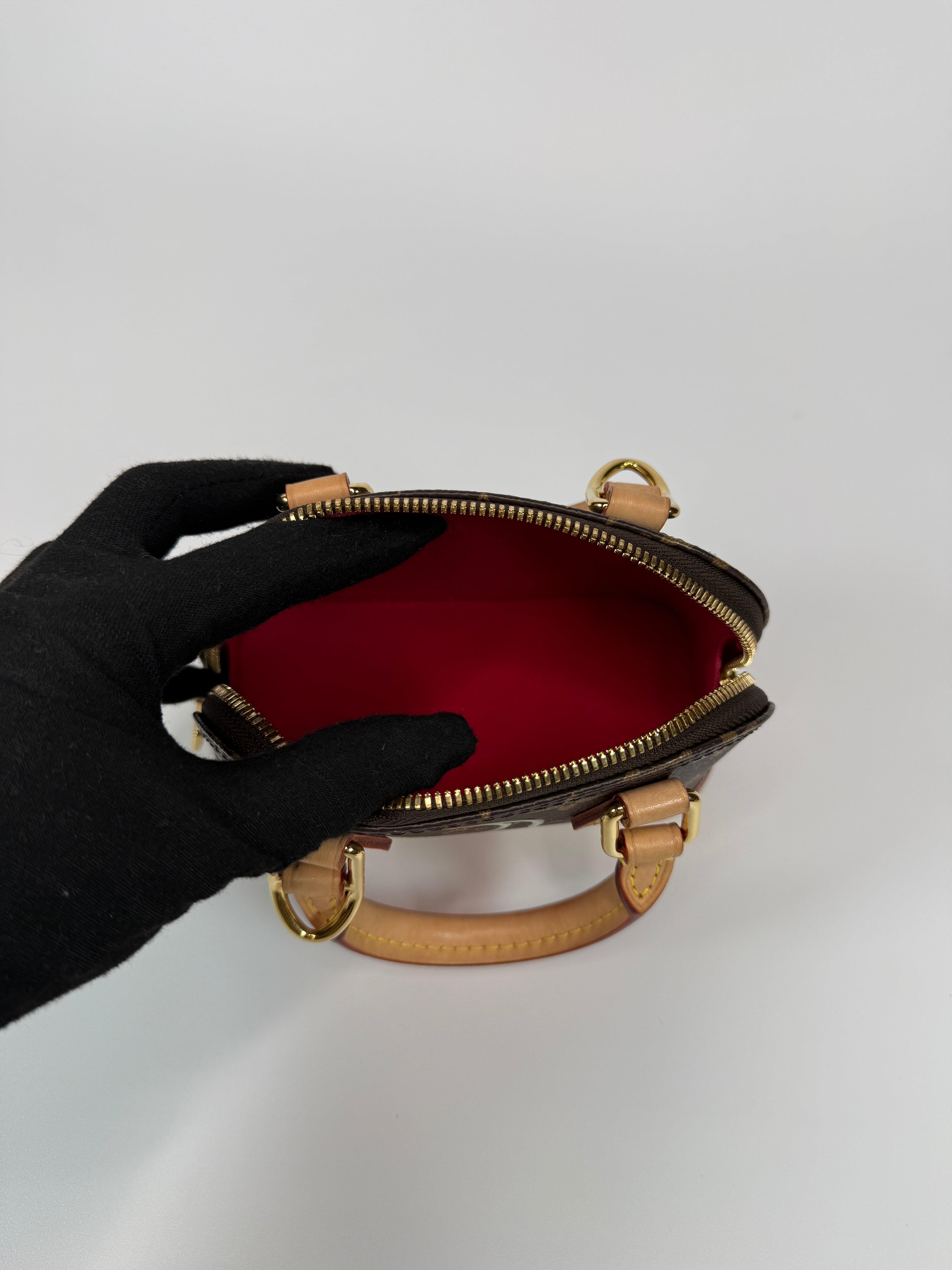 Authentic and preloved Louis Vuitton X Takashi Murakami Nano Alma Cherry Brown Monogram. Excellent condition. 100% Authenticity guarantee. Verified by Luxe Cheshire.