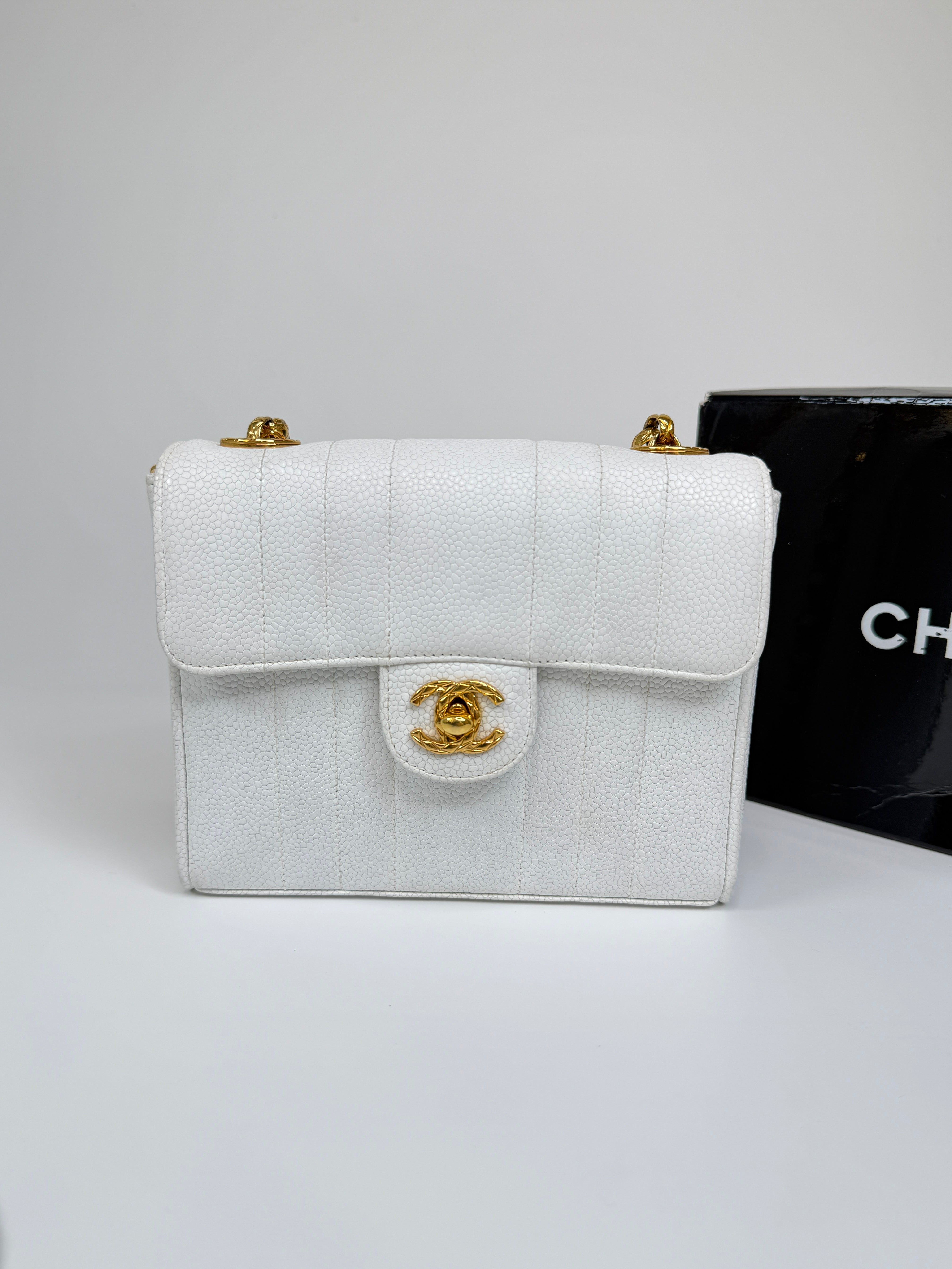 Chanel Vintage Mini Square Flap In White Caviar Leather With 24kt Gold Hardware. Excellent condition 100% Authenticity Guarantee