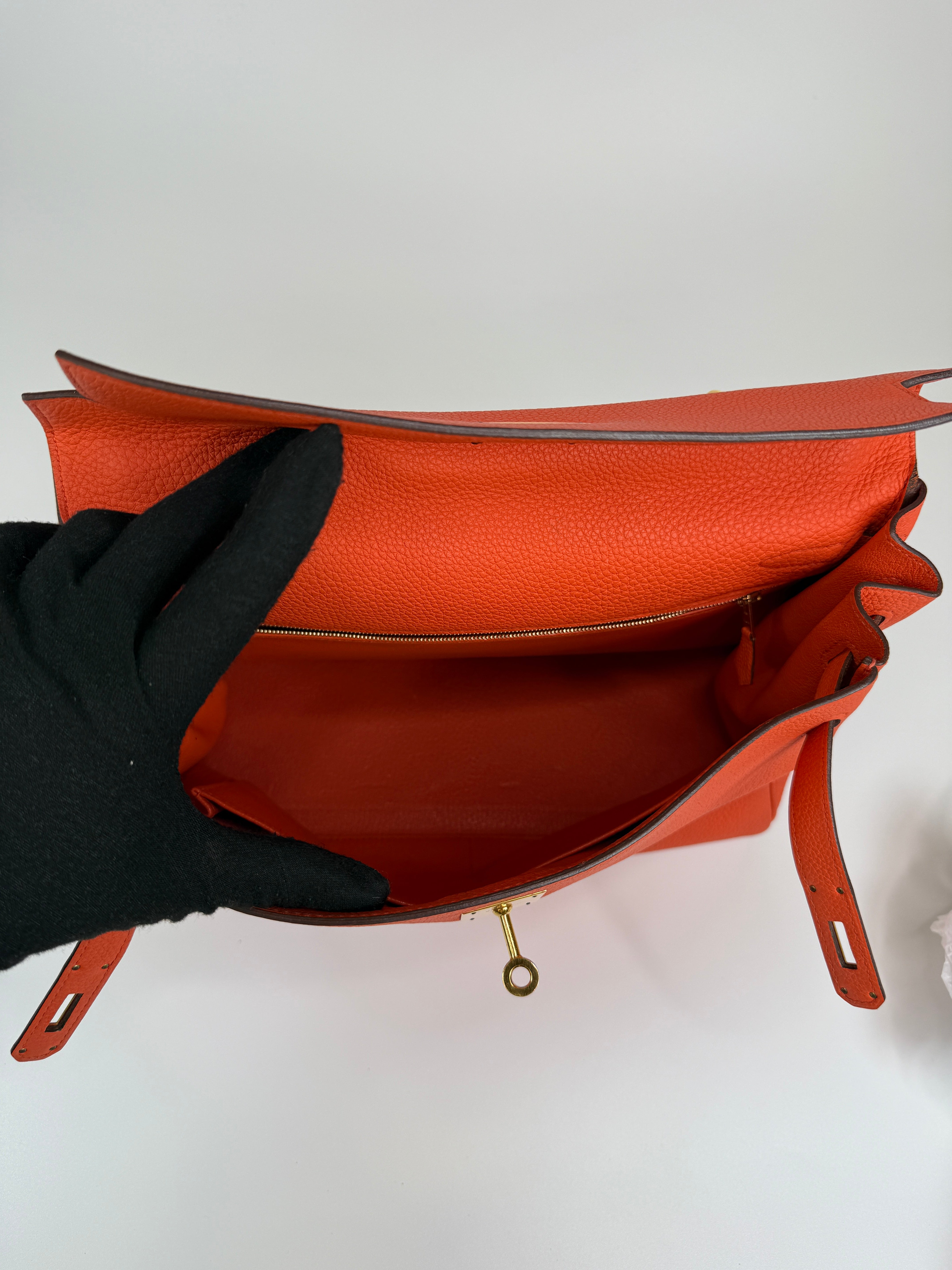 Authentic and preloved Hermès Kelly 28 In Cappucine Togo Leather Gold Hardware. Very Good Condition. 100% Authenticity guarantee