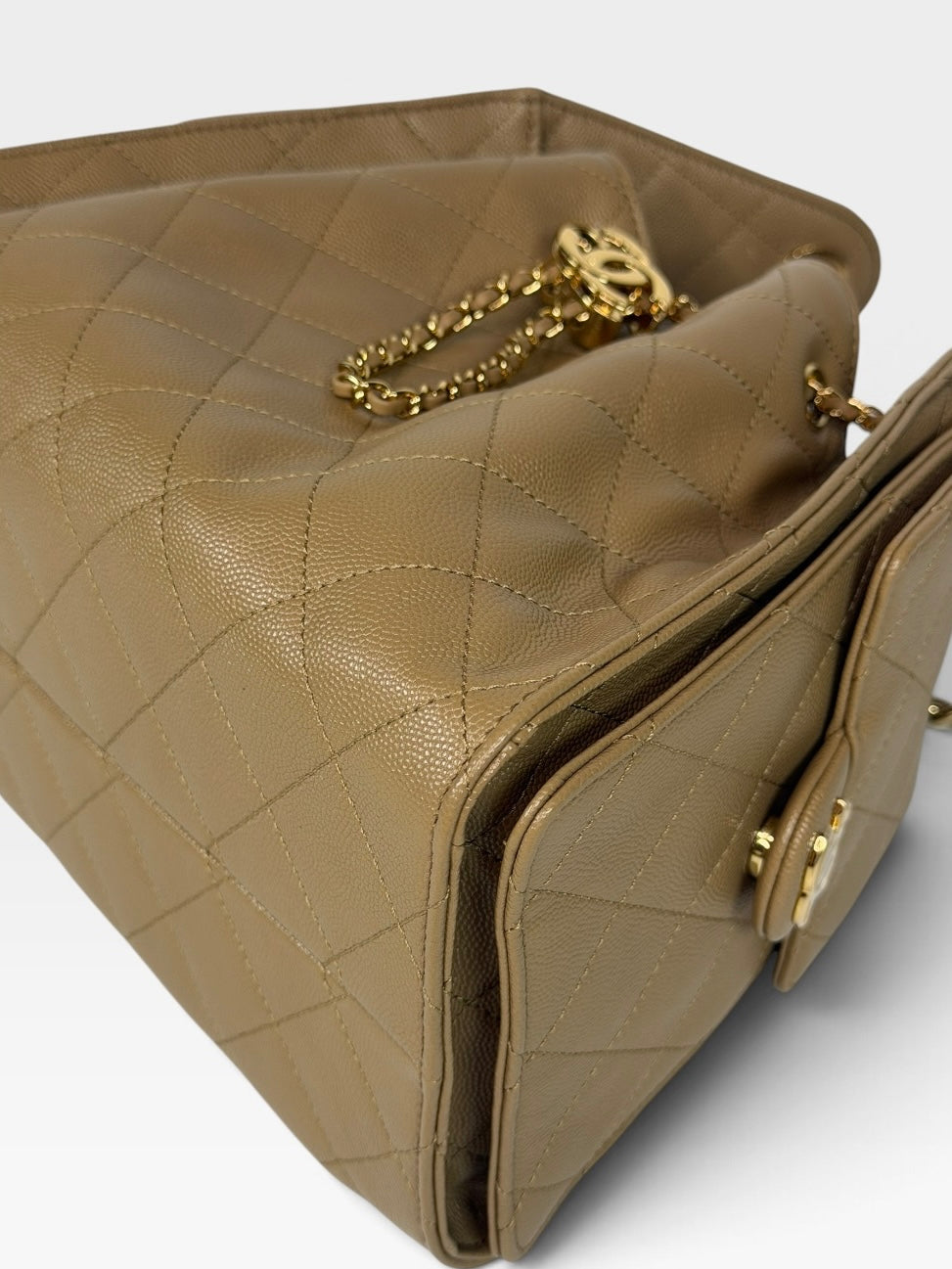 Chanel 25 Small In Brown Caviar Leather With Gold Hardware. 100% authentic and preloved in new and unused condition