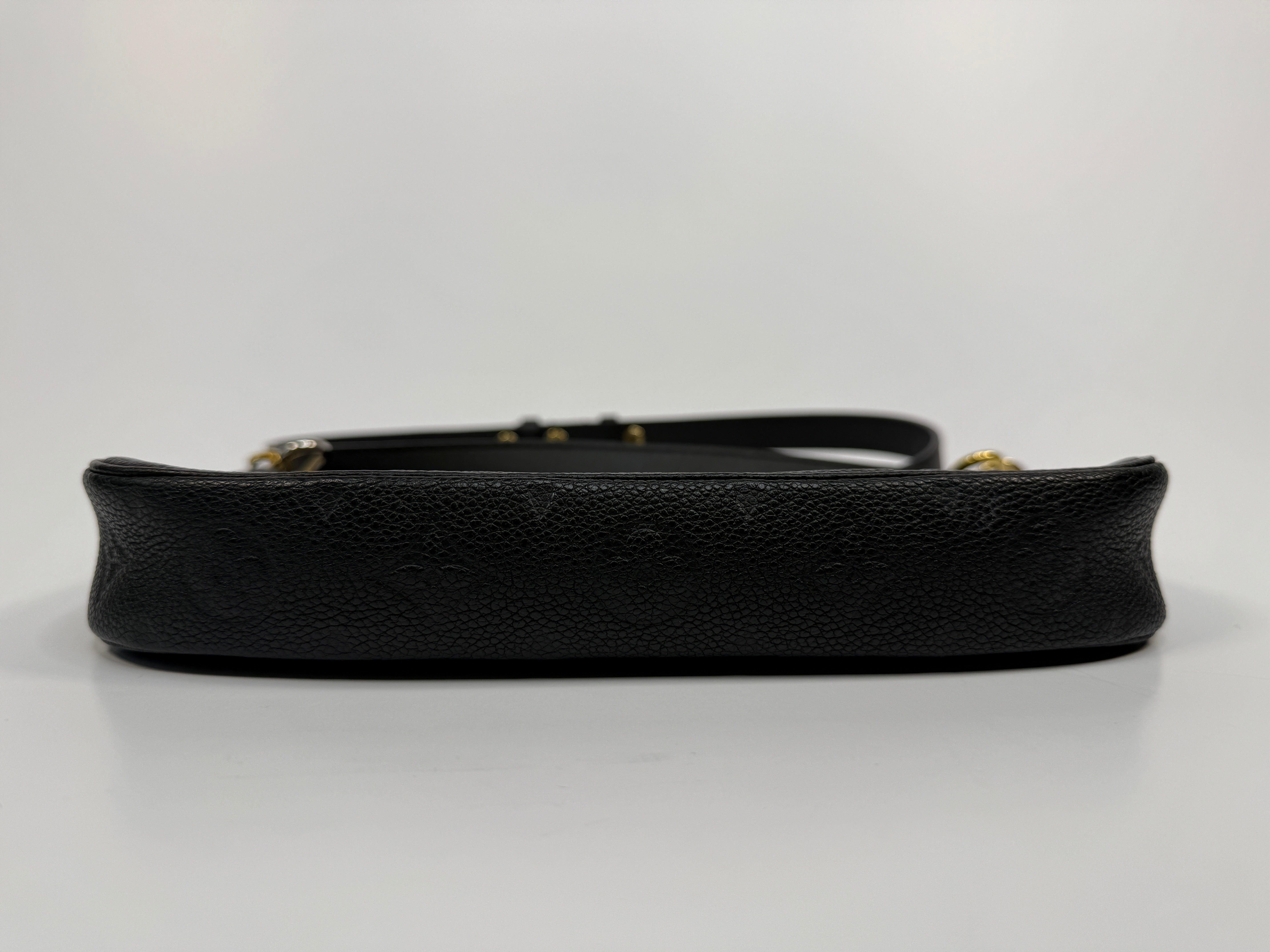 Black leather handbag on a white background