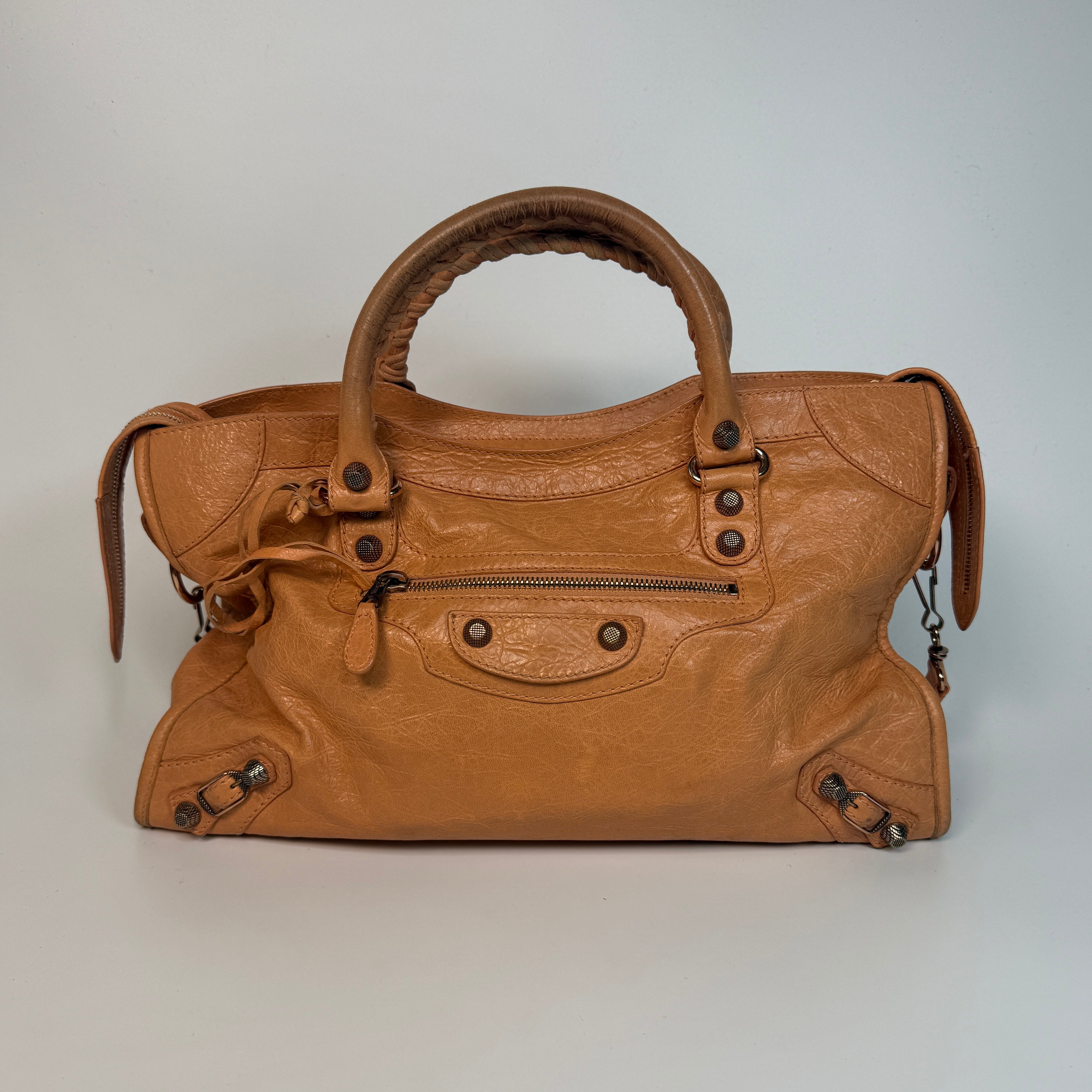 Authentic and preloved Balenciaga Medium Le City Bag In Peach Leather with silver hardware. Very good condition. 100% Authenticity guarantee.