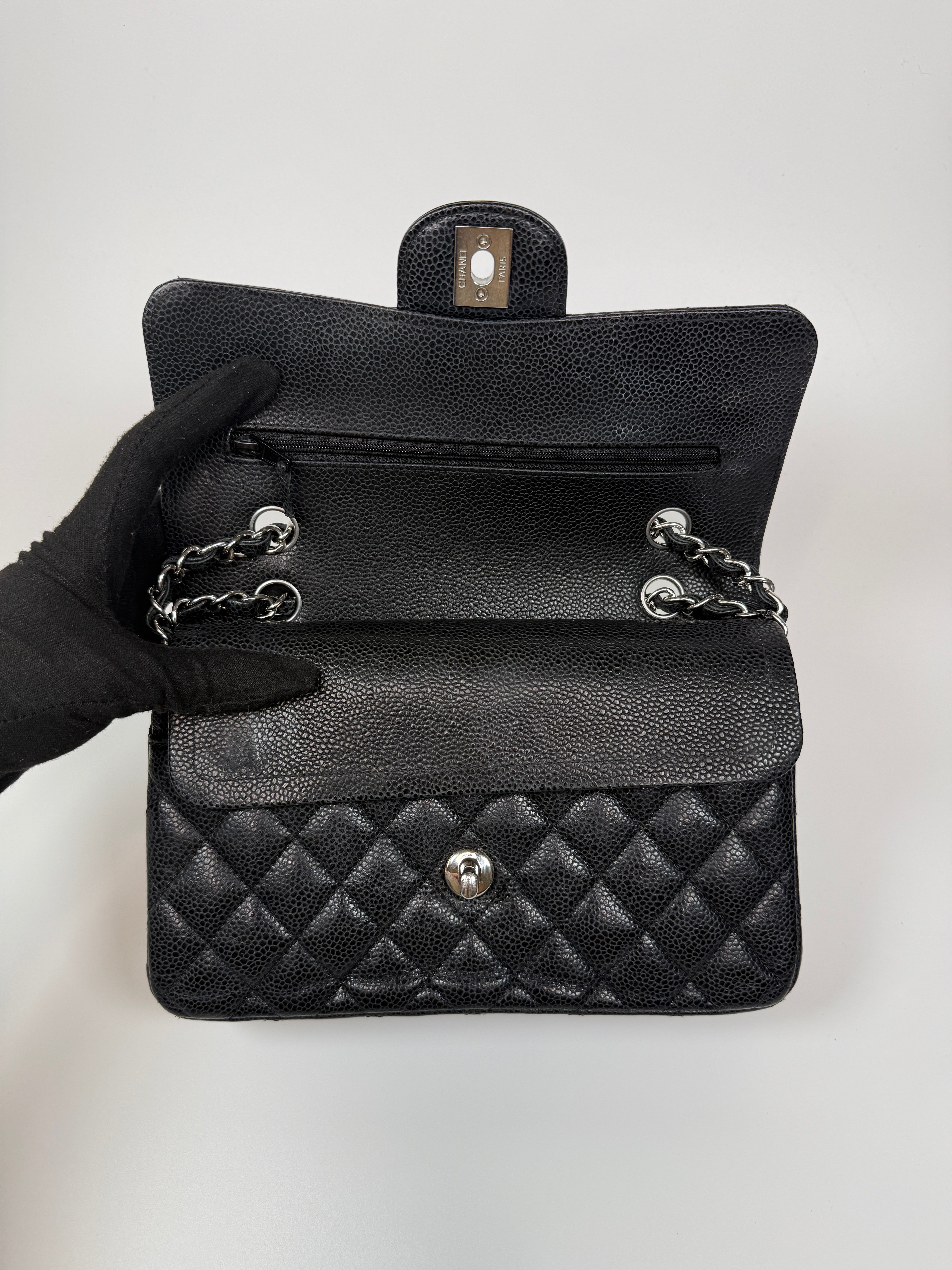 Chanel Small Classic Double Flap In Black Caviar Leather With Silver Hardware. Authentic and preloved in very good condition. 100% Authenticity guarantee