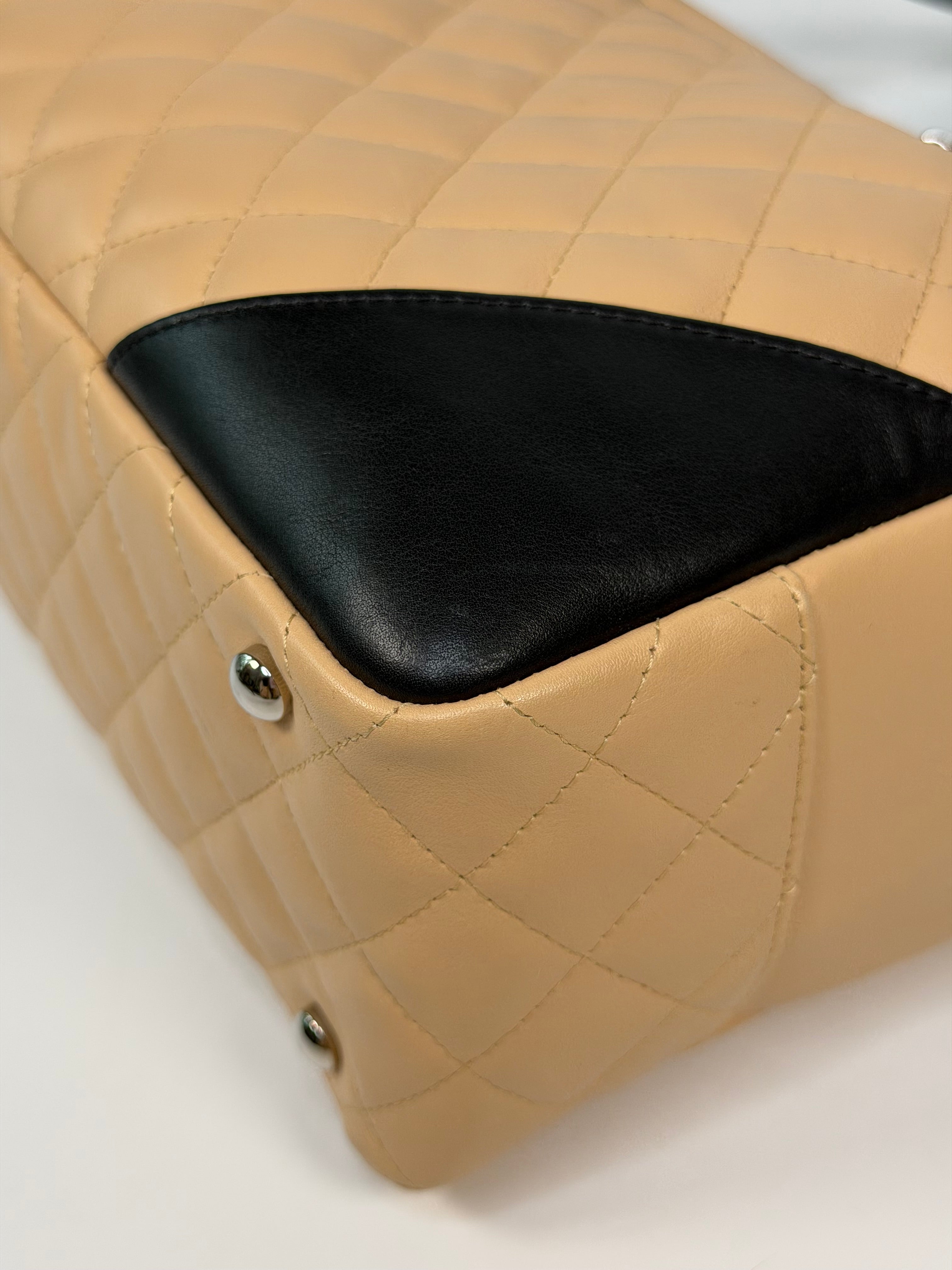 Chanel Cambon Bowling Bag In Beige / Black Leather With Silver Hardware. Authentic and preloved in excellent condition.