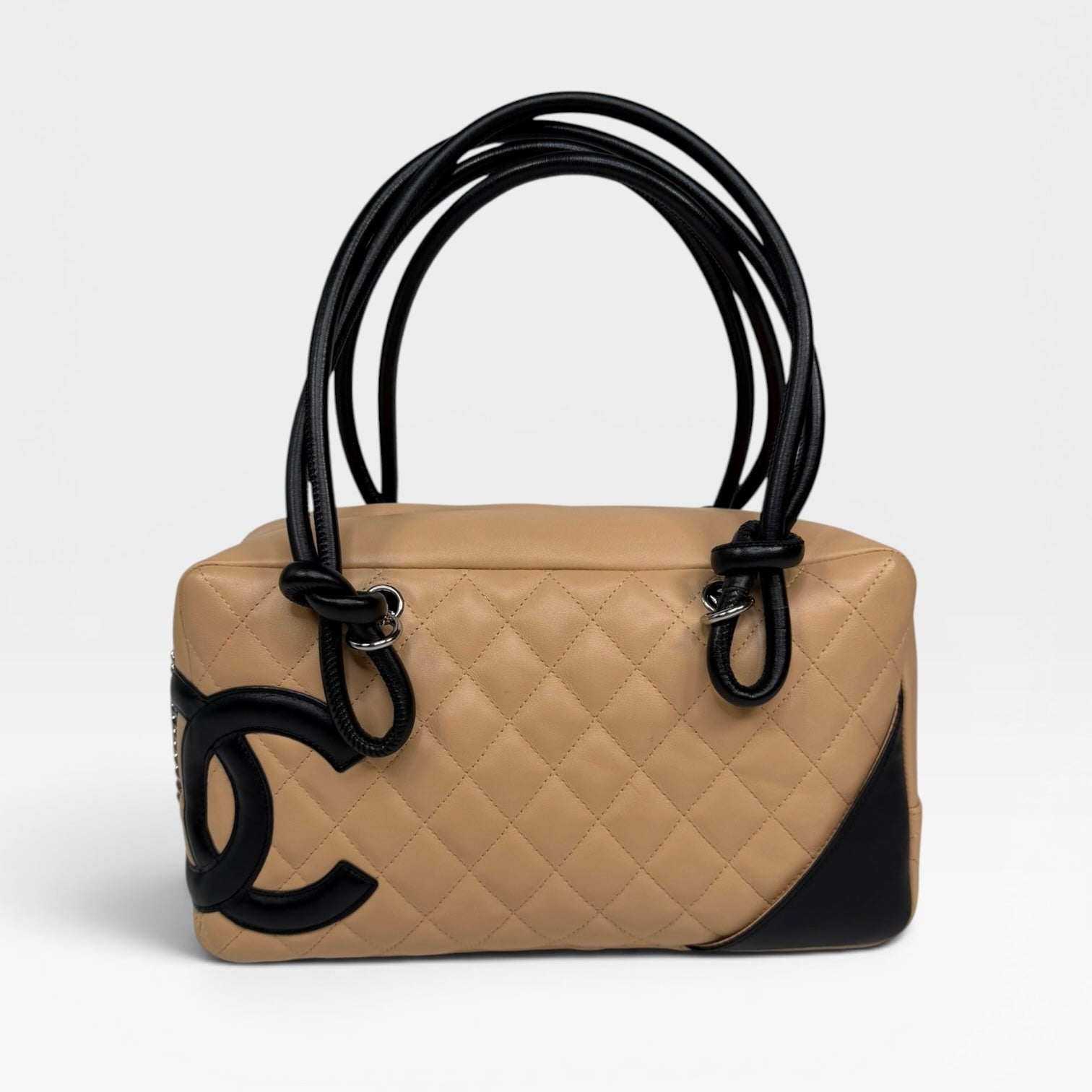 Chanel Cambon Bowling Bag In Beige / Black Leather With Silver Hardware. Authentic and preloved in excellent condition.