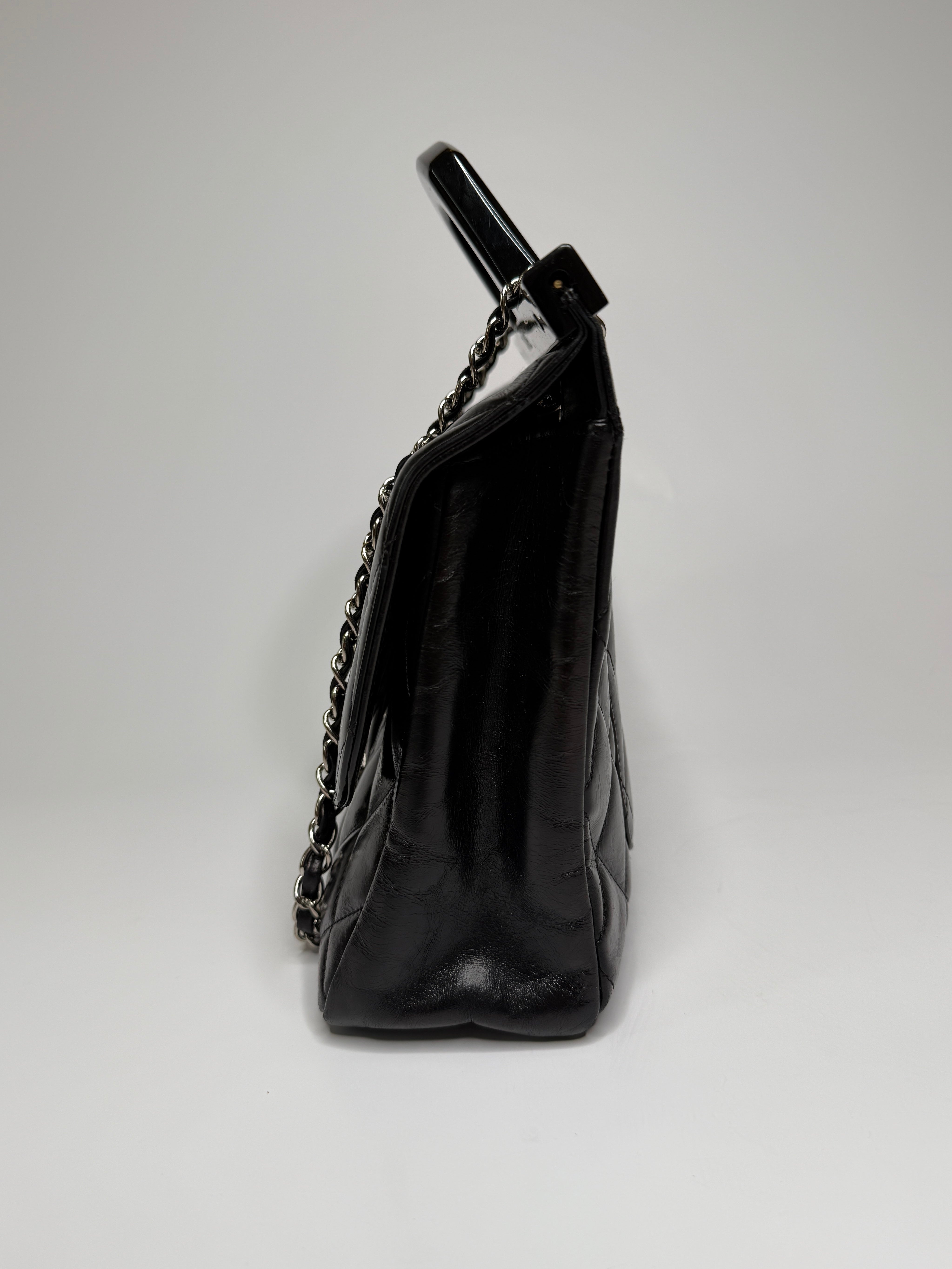Chanel Delivery Top Handle Flap Bag In Black Calfskin Leather With Silver hardware in very good condition Authentic and preloved