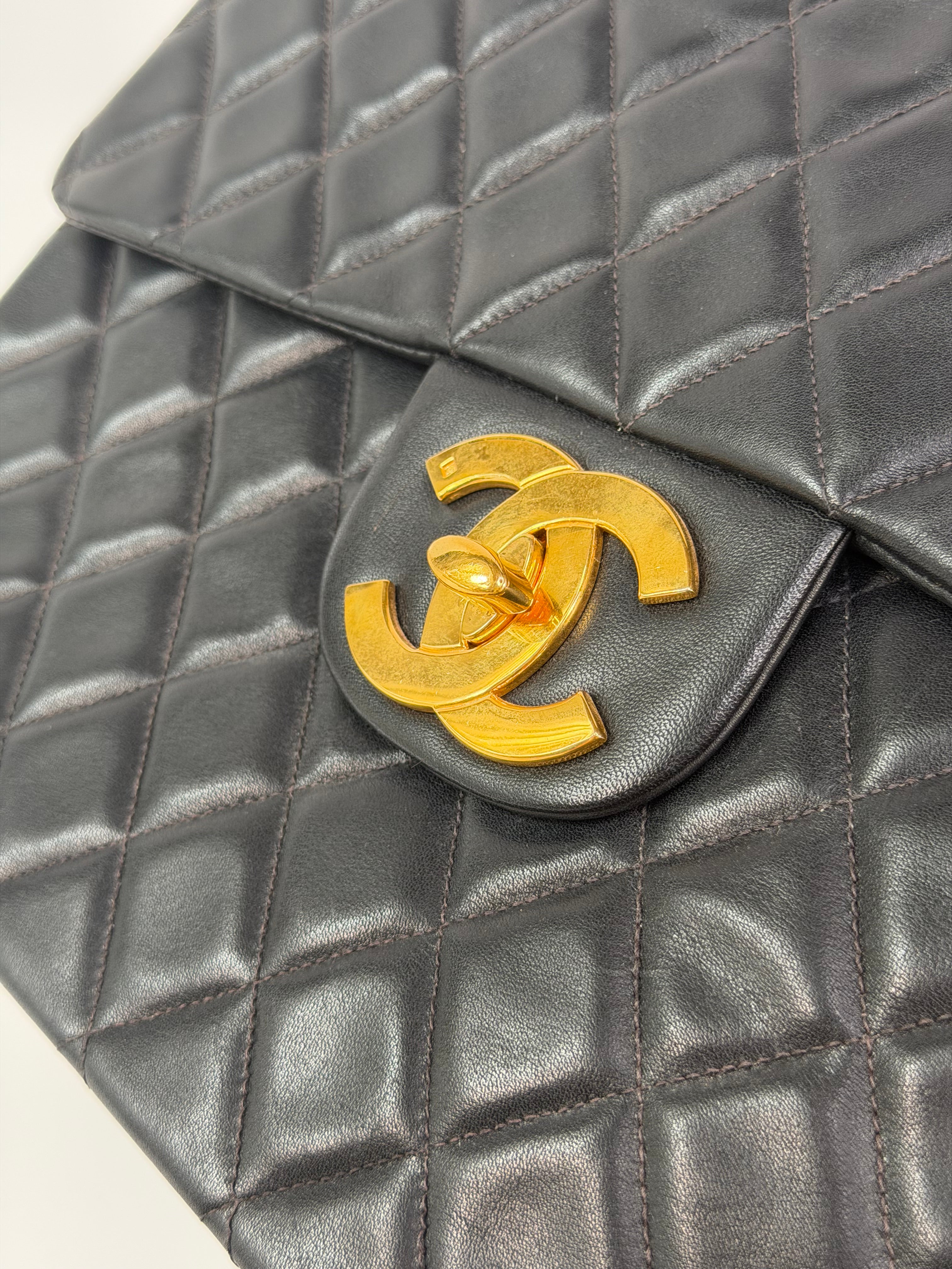 Chanel Vintage XL Maxi Flap Bag In Black Lambskin Gold Hardware. 100% authentic and preloved in excellent condition