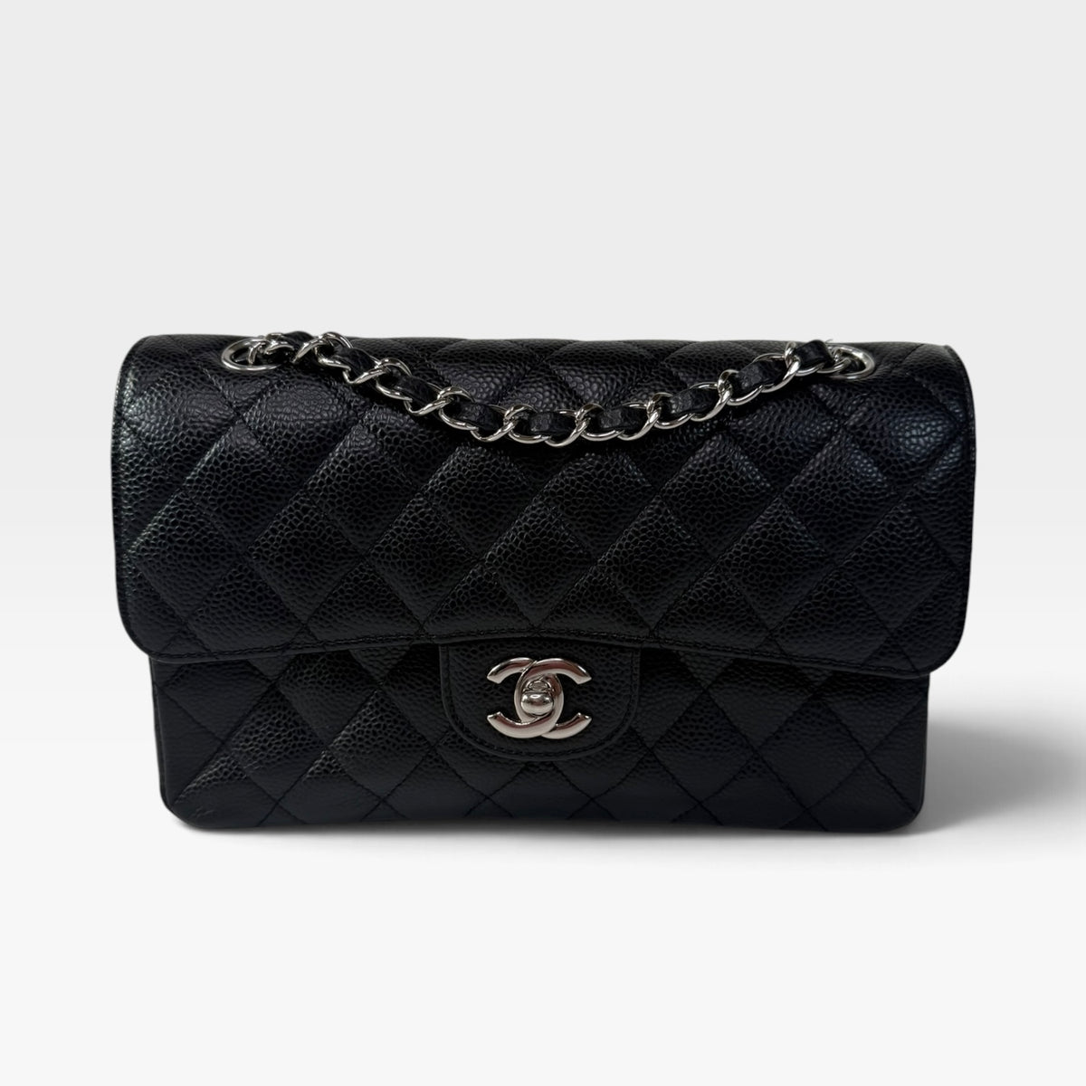 Chanel Vintage Small Classic Double Flap In Black Caviar Leather With Silver Hardware. 100% authentic and preloved in excellent condition
