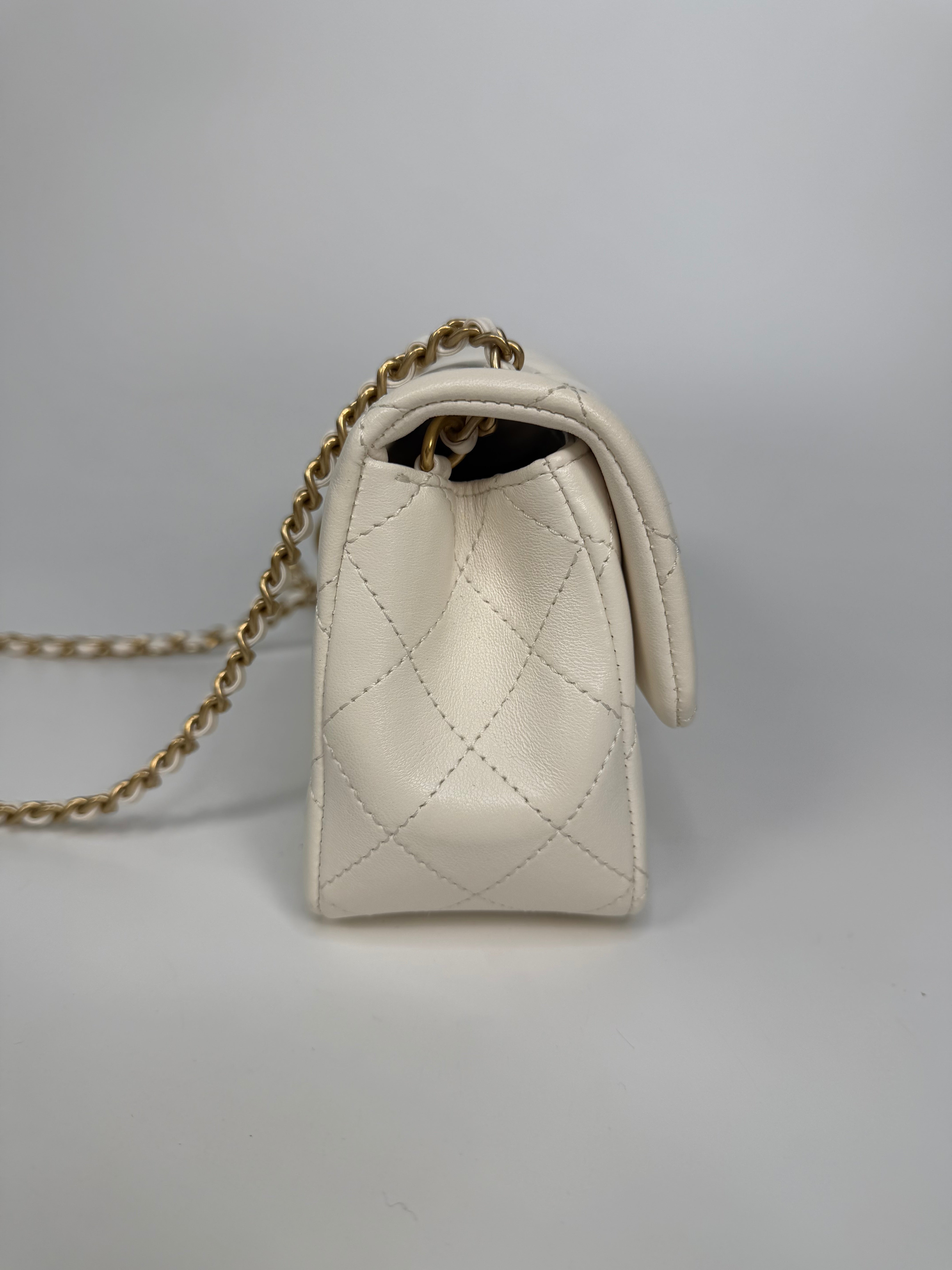 Chanel Pearl Crush Mini Rectangle In White Lambskin Leather Gold Hardware. Authentic and preloved in excellent condition with 100% authenticity guarantee.