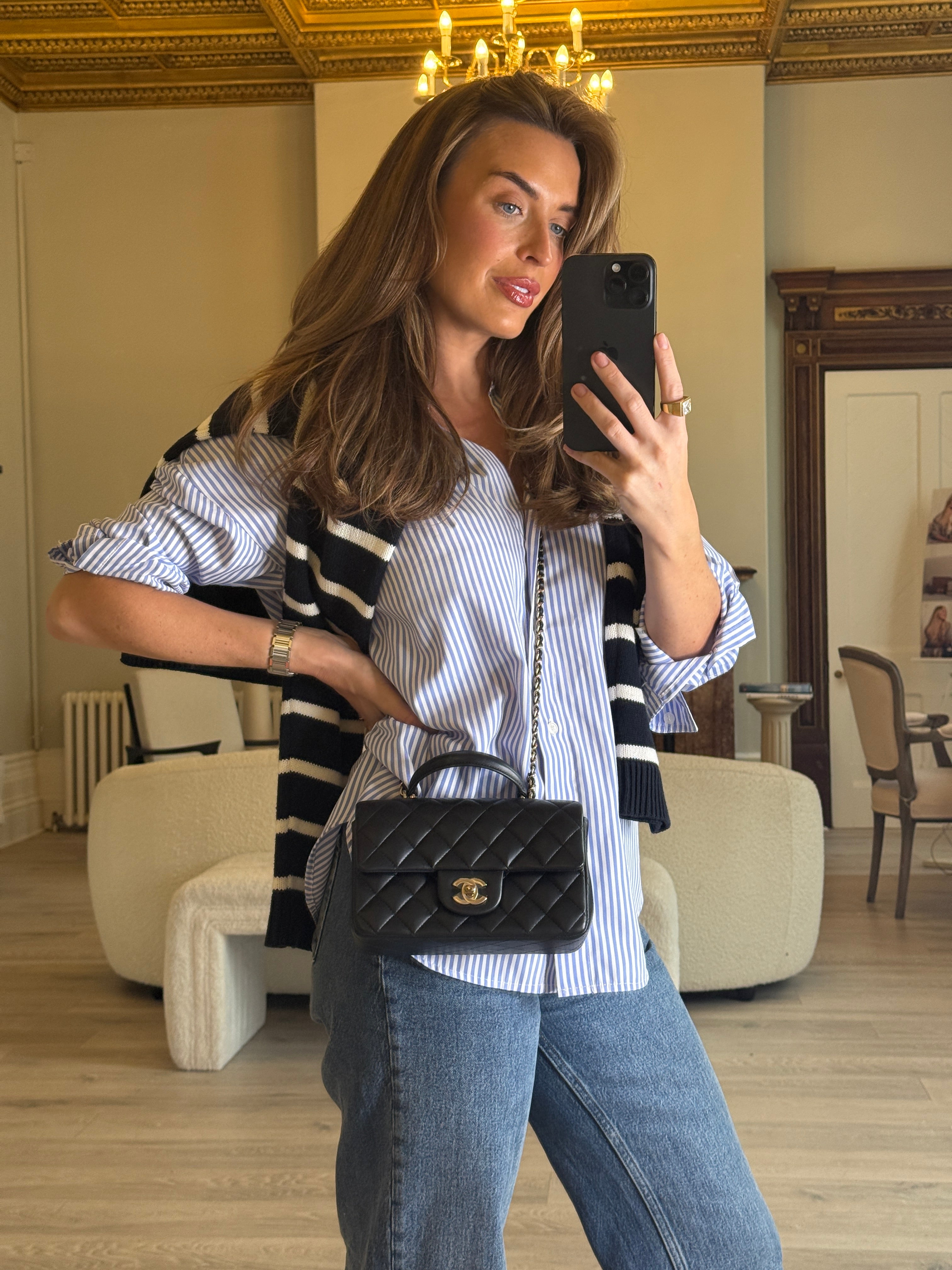 Authentic and preloved Chanel Mini Rectangle Top Handle Flap Bag In Black Lambskin With Gold hardware. Excellent Condition. 100% Authenticity guarantee