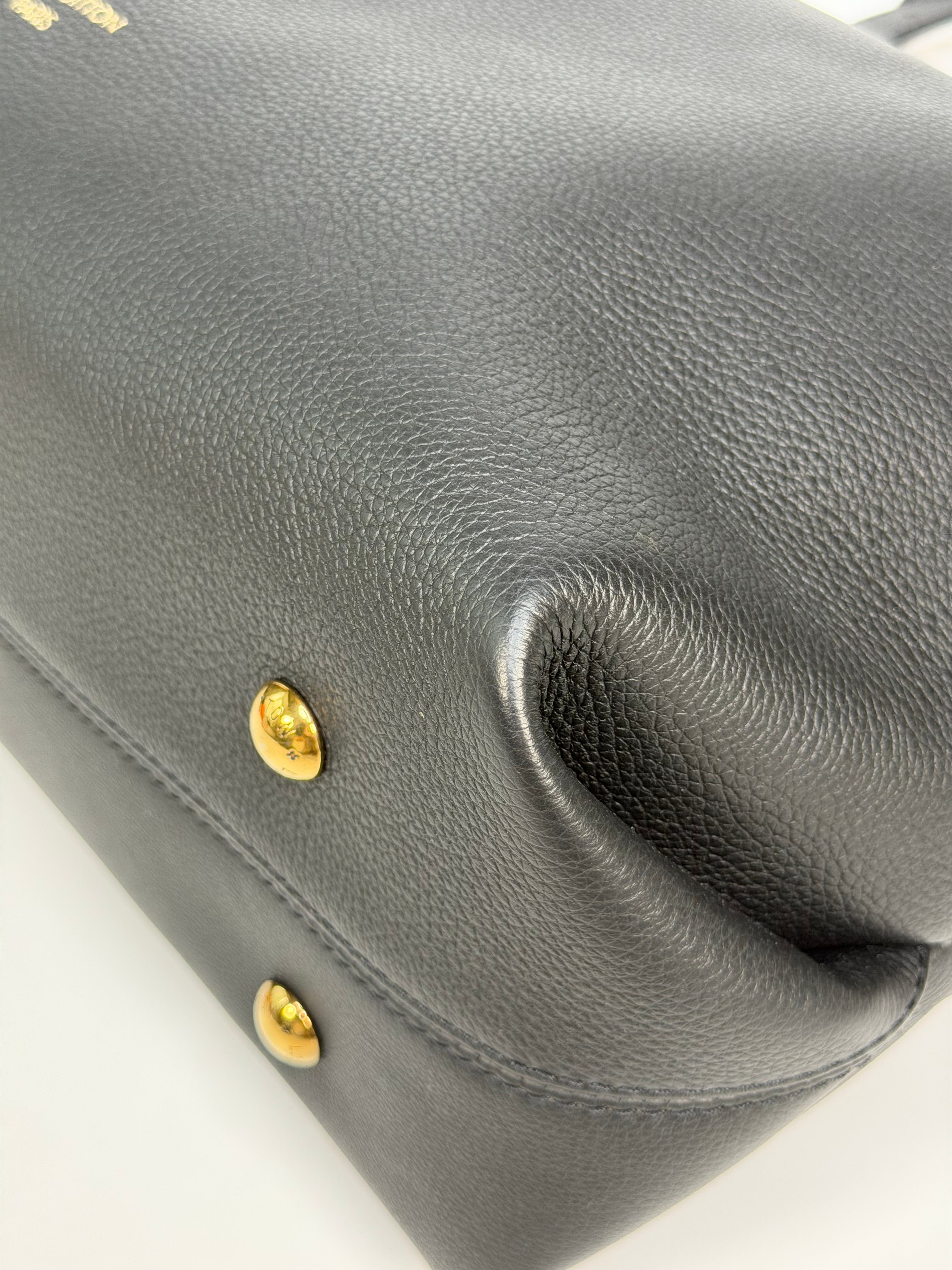 Louis Vuitton Low Key Cabas MM In Black Calfskin With Gold Hardware. Authentic and preloved in excellent condition