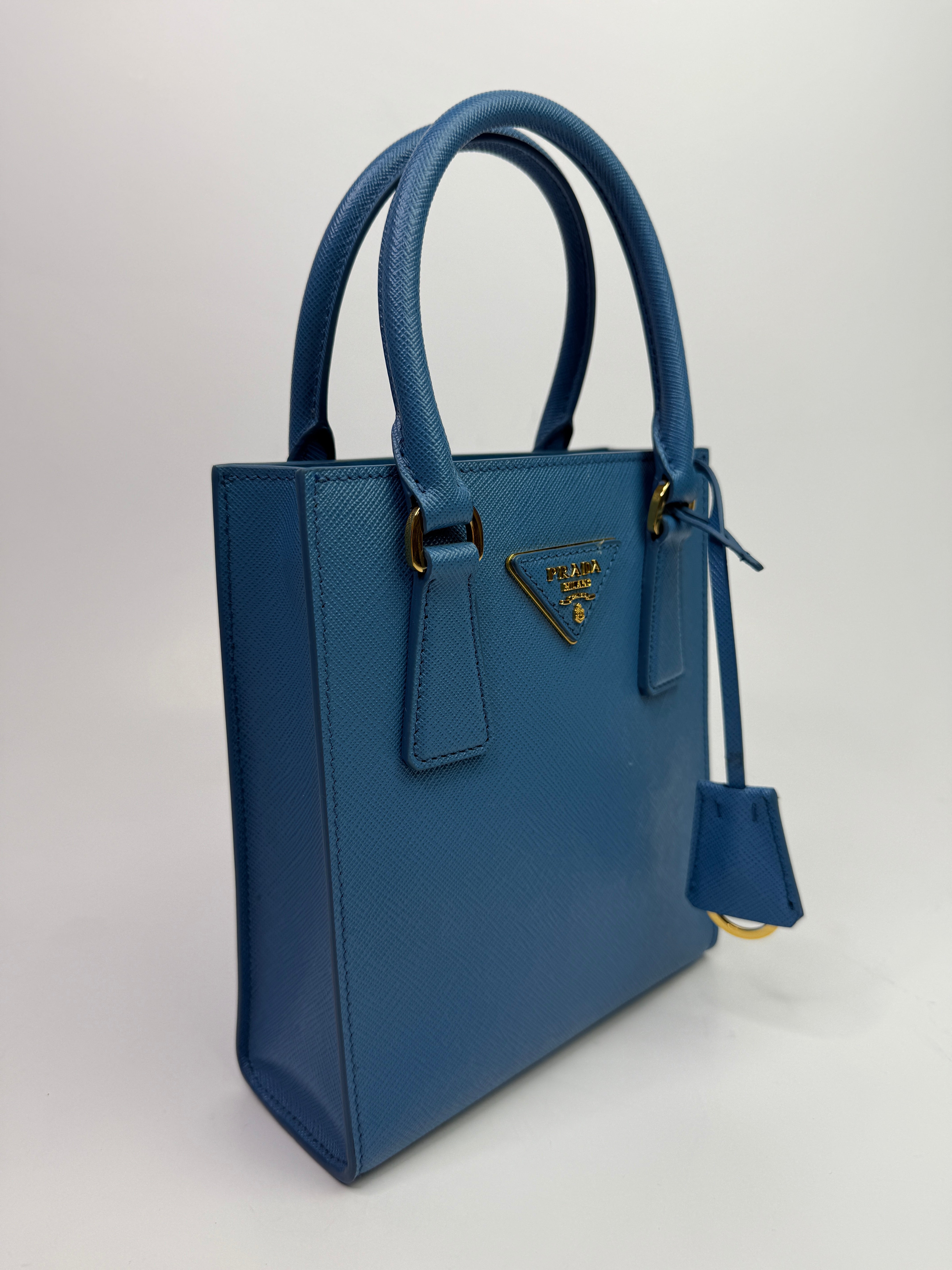 Prada Mini Tote In Powder Blue Saffiano Leather
Authentic Pre Loved Verified by Luxe Cheshire Trusted Designer resale