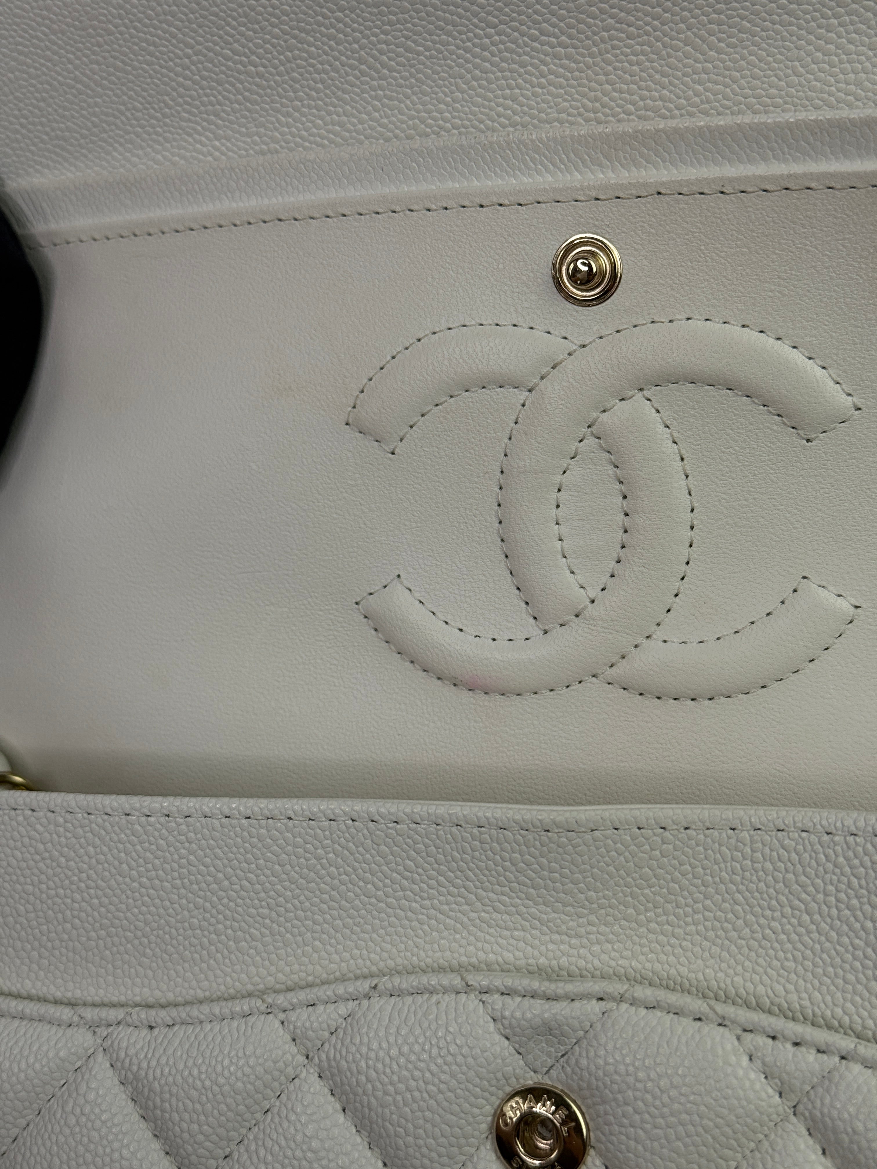 Authentic pre-loved Chanel Medium Classic Double Flap White Caviar Leather With Gold Hardware.