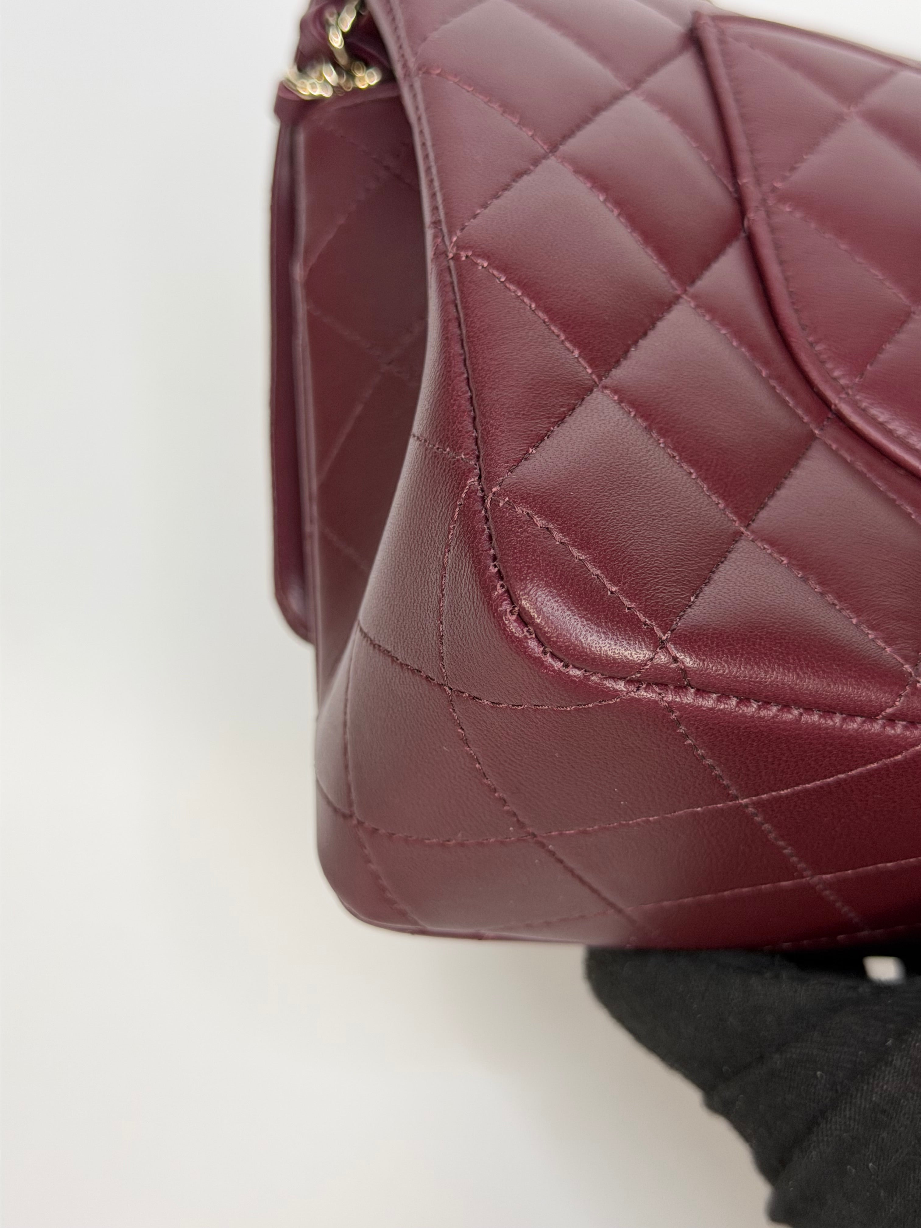 Chanel Medium Classic Double Flap Burgundy Lambskin Leather With Pale Gold Hardware. Authentic and preloved in excellent condition with 100% authenticity guarantee.