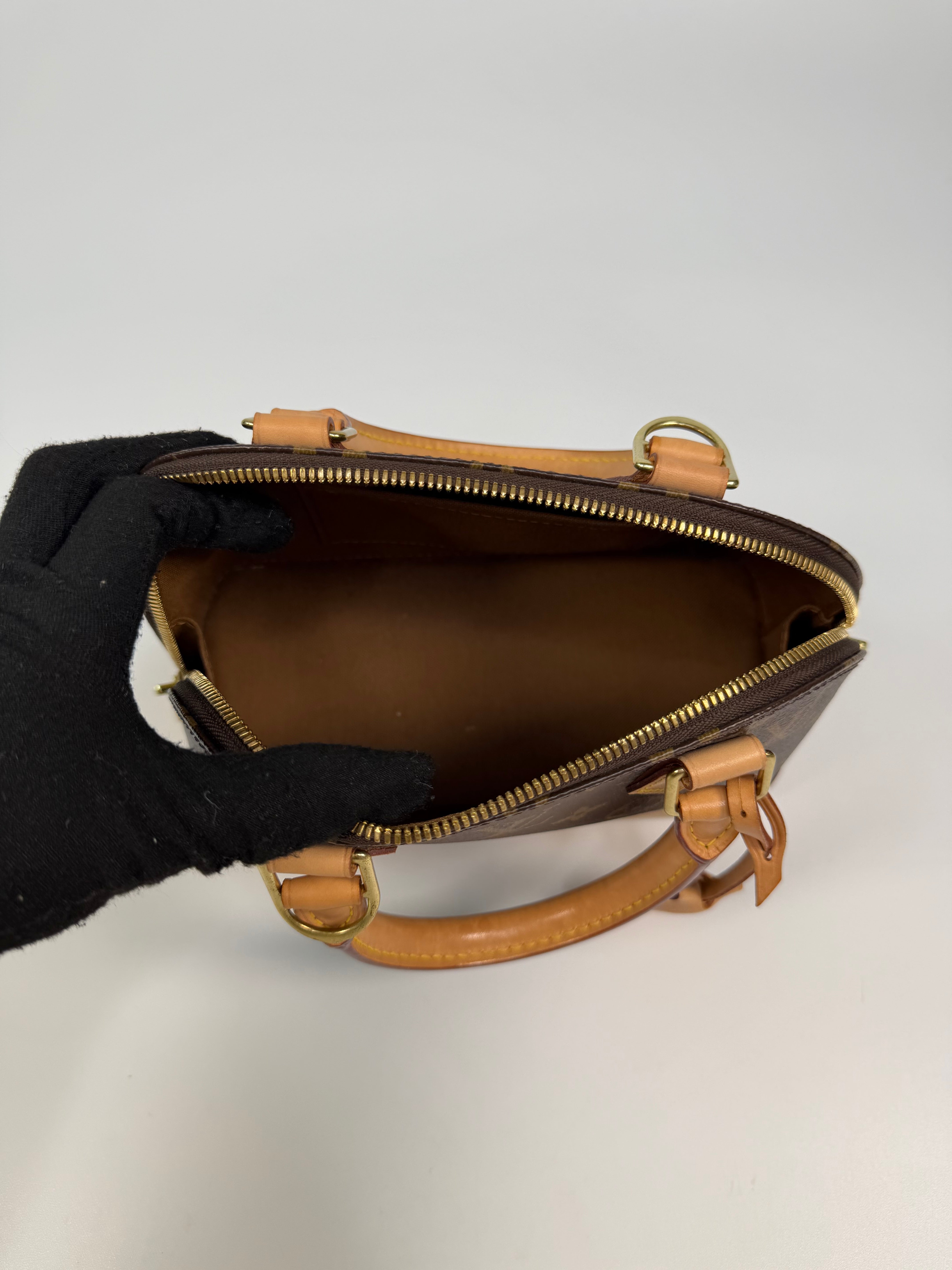 Louis Vuitton Alma BB In Brown Monogram Canvas With Gold Hardware. Authentic and preloved in very good condition