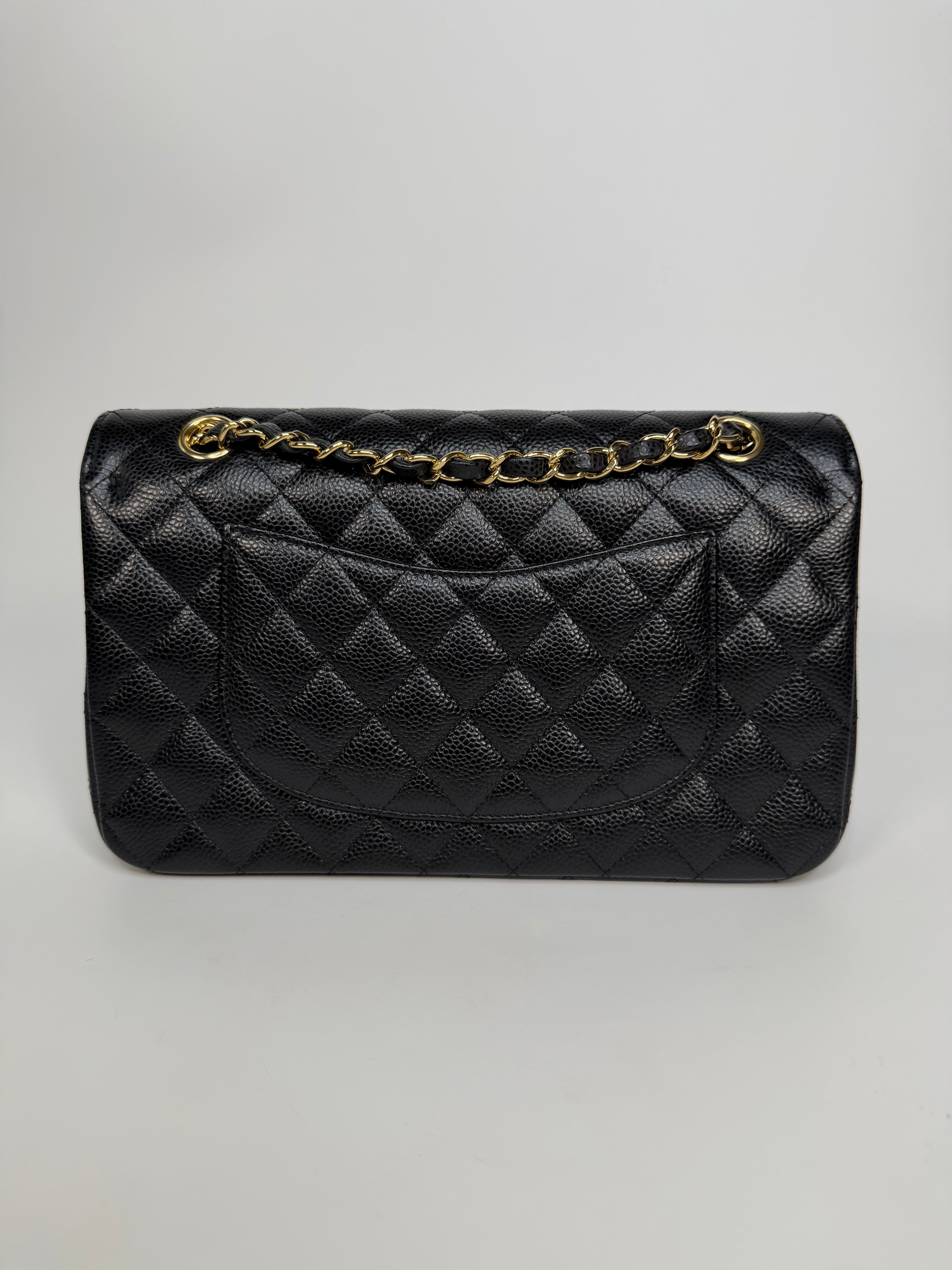 Chanel Medium Classic Double Flap In Black Caviar With Gold Hardware. Authentic and preloved in new and unused condition.