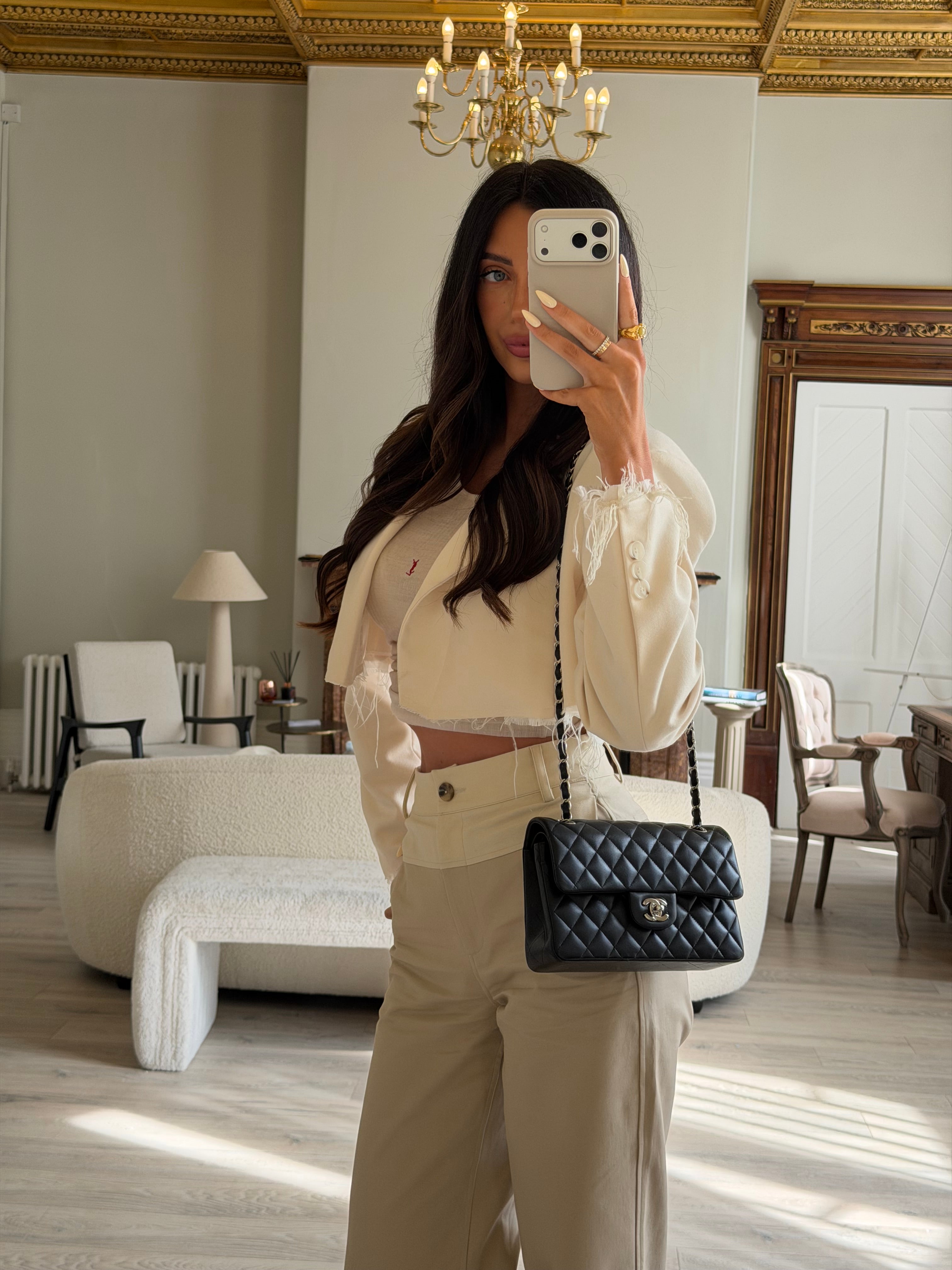 Chanel Small Classic Double Flap In Black Lambskin Leather With Silver Hardware Authentic and preloved in excellent condition. 100% Authenticity guarantee