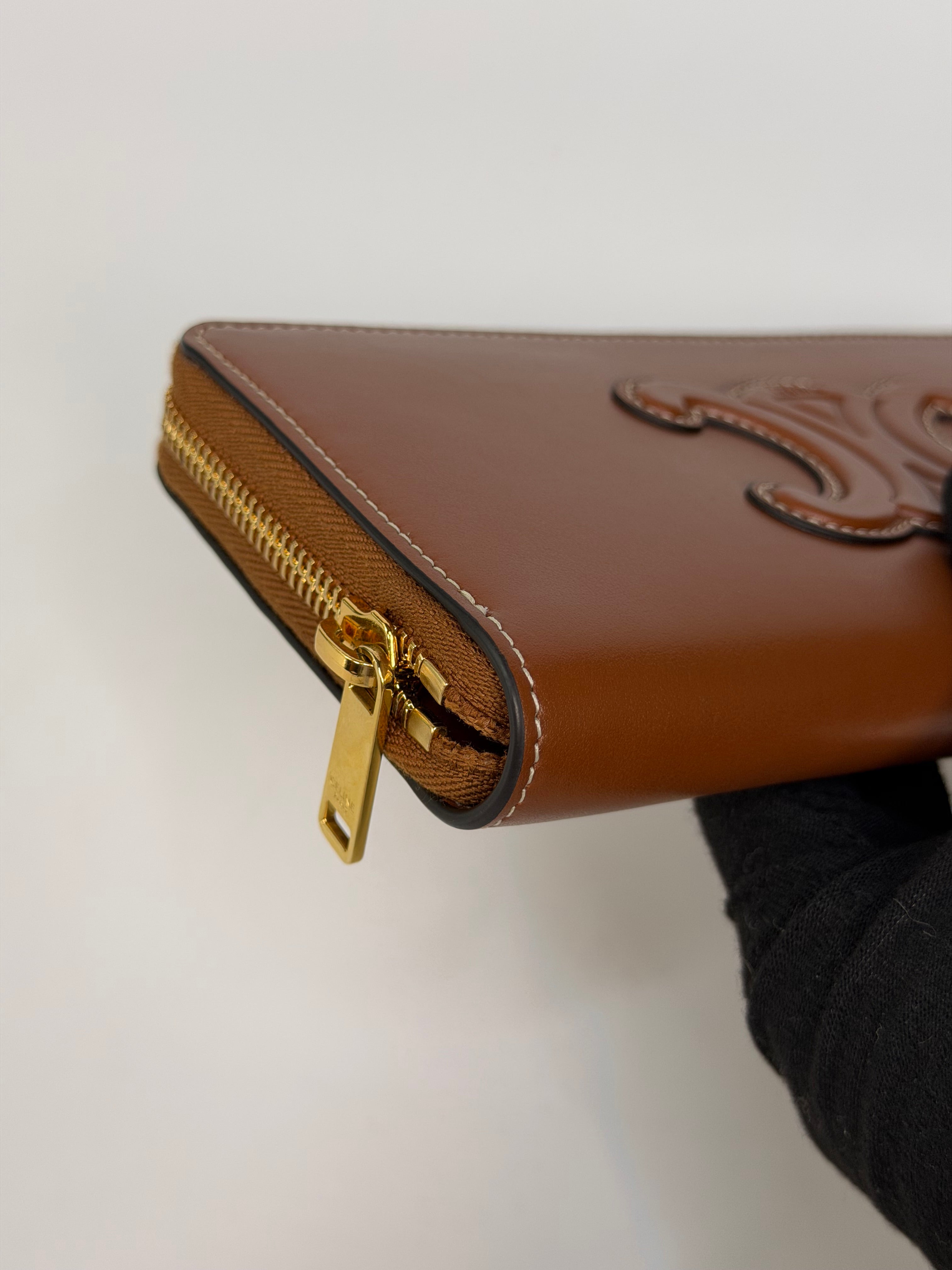 Celine Triomphe Long Wallet In Tan Calfskin With Gold Hardware. Authentic and preloved in excellent condition