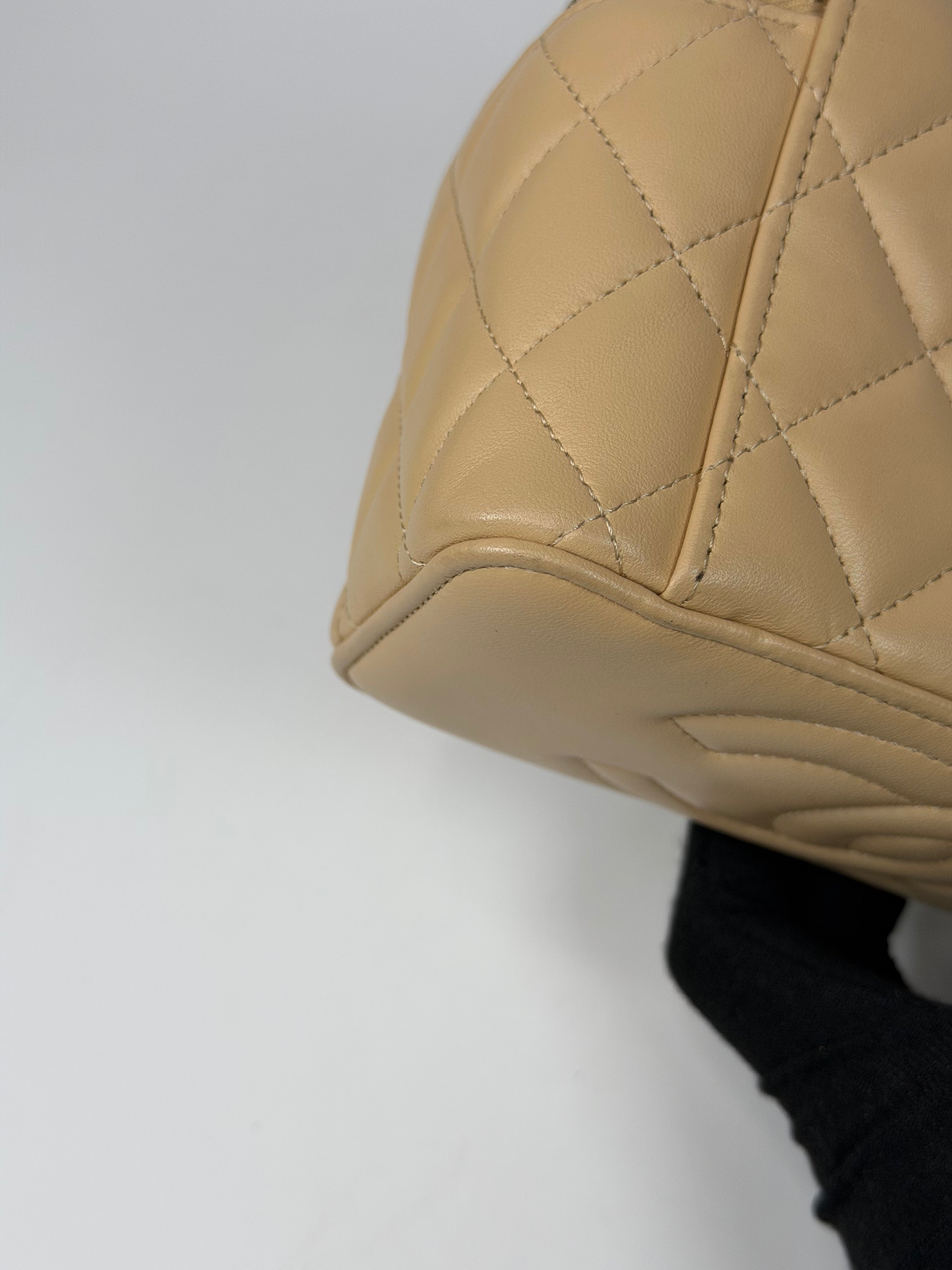 Chanel Mini Vanity Top Handle In Light Beige Lambskin Leather With Gold Hardware. Authentic and preloved in excellent condition. Insured next day delivery. Verified by Luxe Cheshire