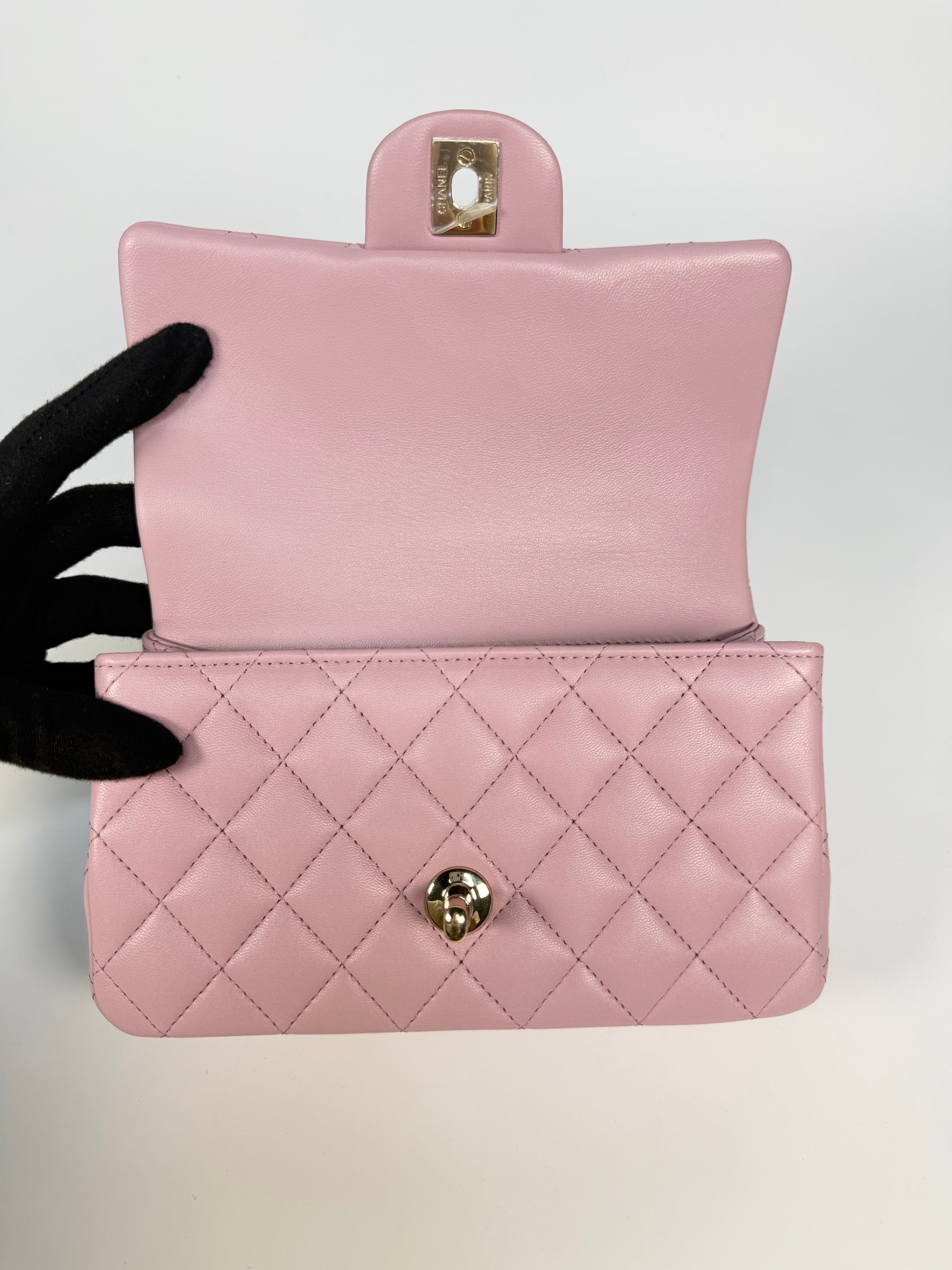 Chanel Mini Rectangle Top Handle In Pink Lambskin Leather With Pale Gold Hardware. 100% authentic and preloved in excellent condition