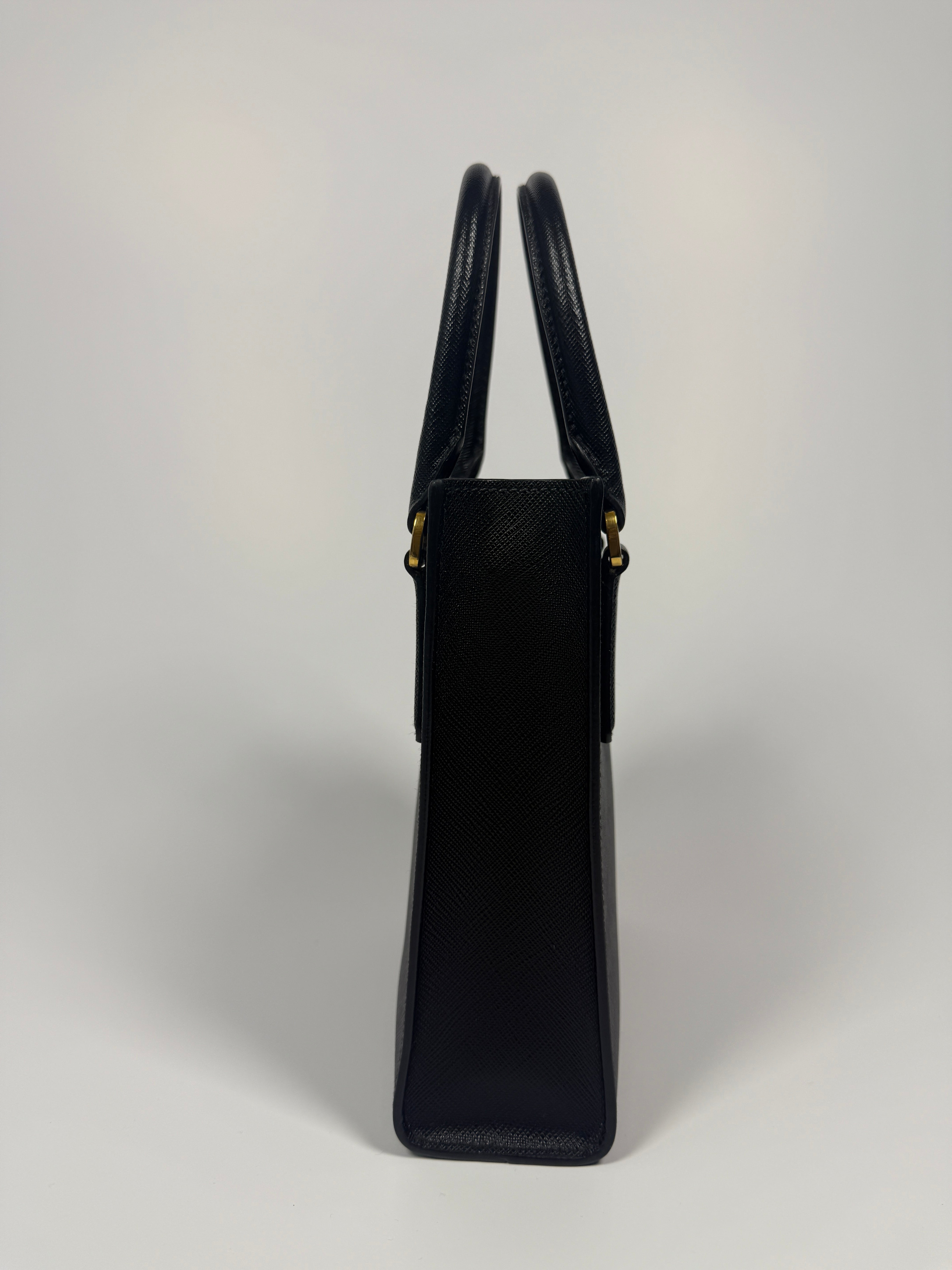 Prada Mini Tote In Black Saffiano Leather With Gold Hardware. 100% Authentic and preloved in excellent condition