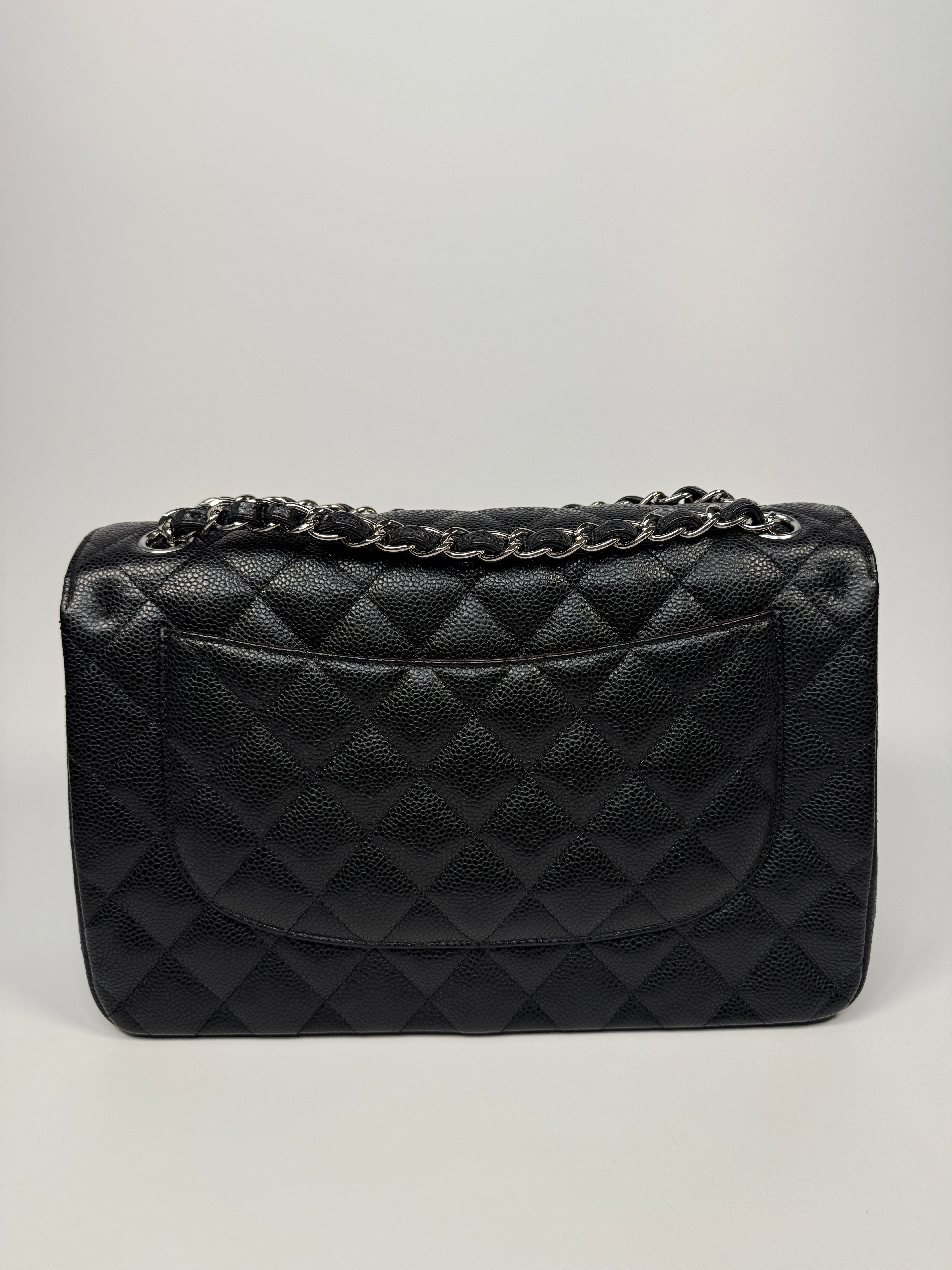 Chanel Classic Jumbo Flap Bag In Black Caviar Leather With Silver Hardware. Authentic and preloved. Excellent condition.