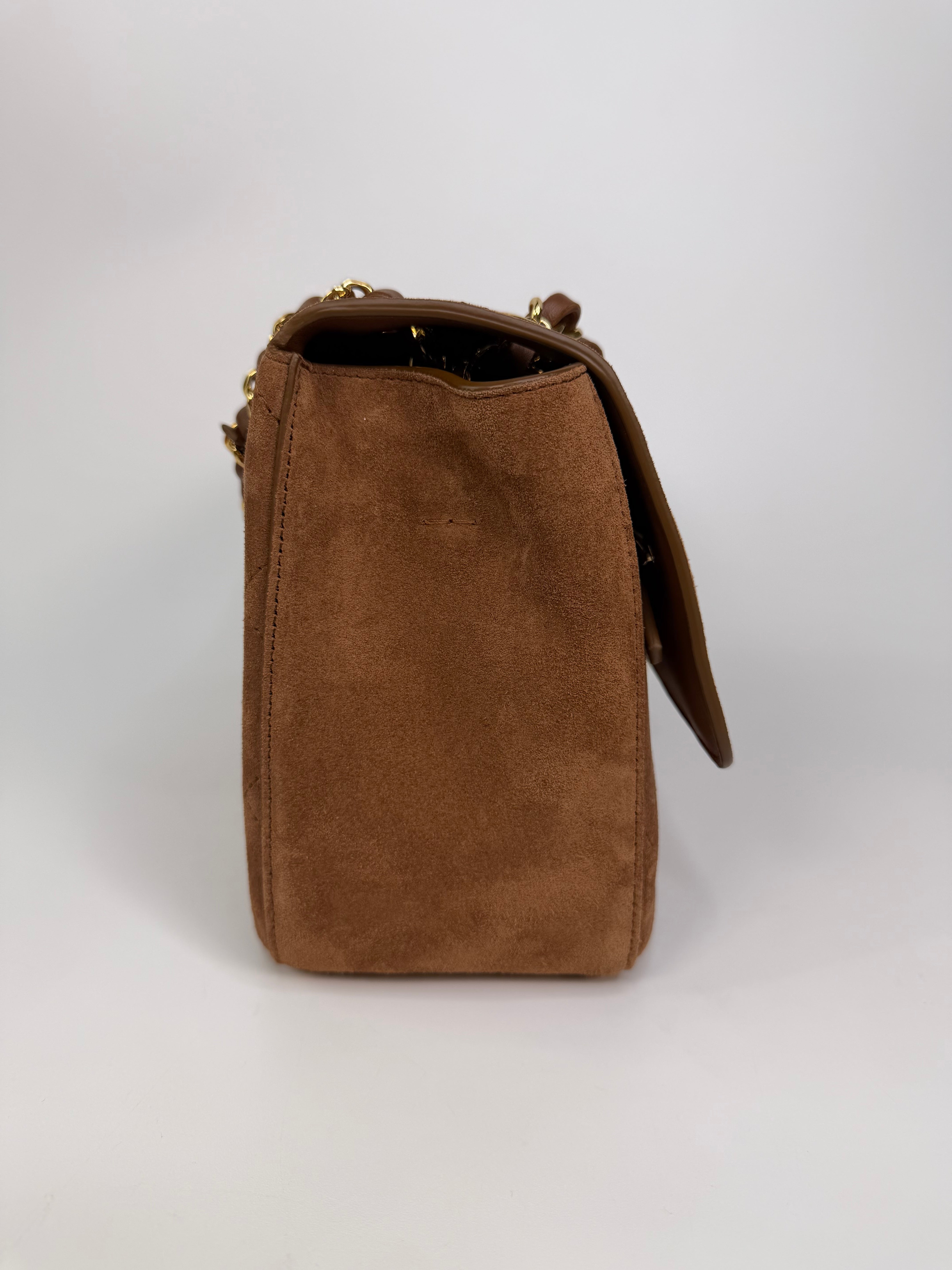 Chanel Maxi Flap In Tan Suede With Gold Hardware. Authentic and preloved in new and unused condition.