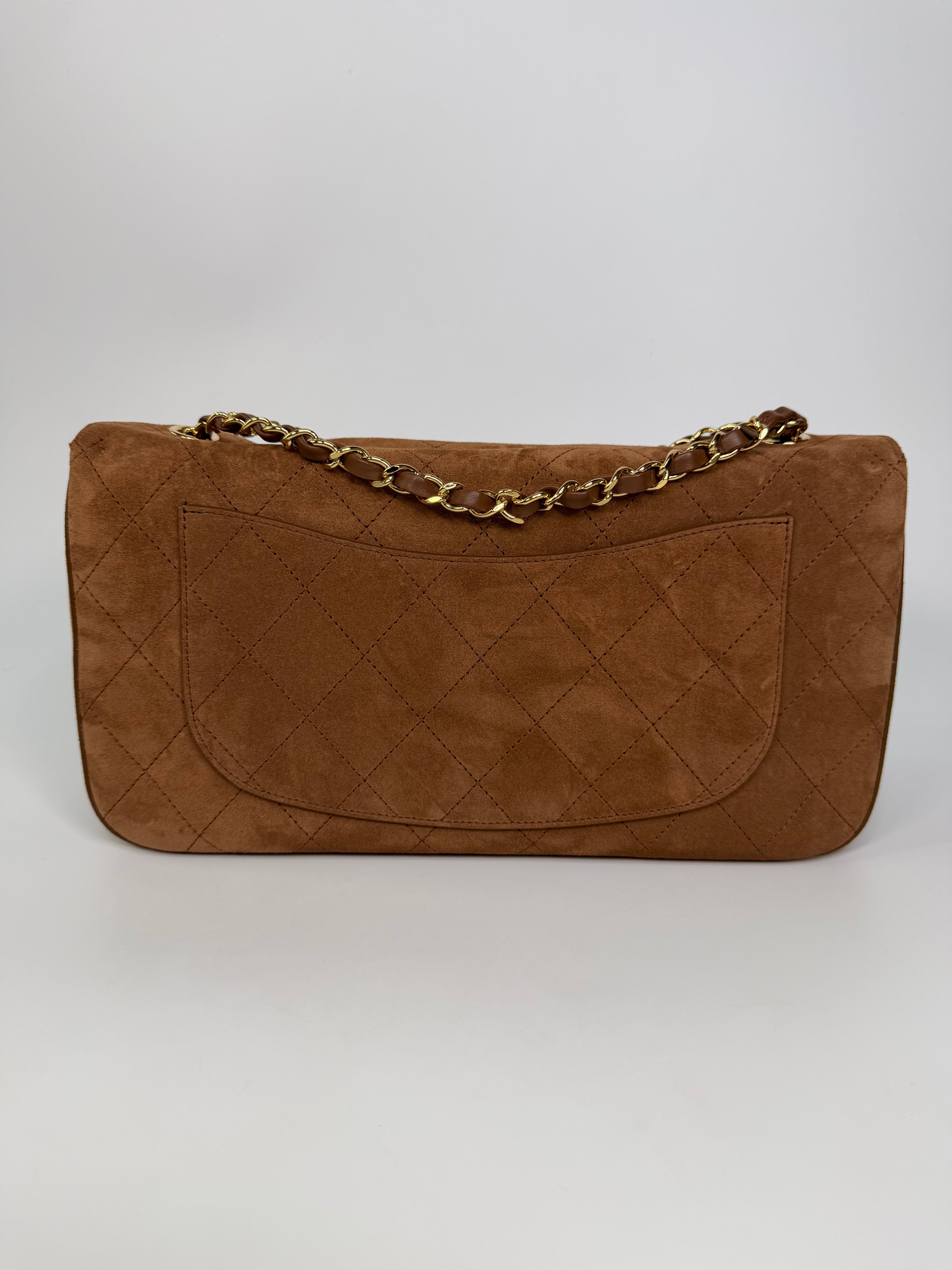 Chanel Maxi Flap In Tan Suede With Gold Hardware. Authentic and preloved in new and unused condition.