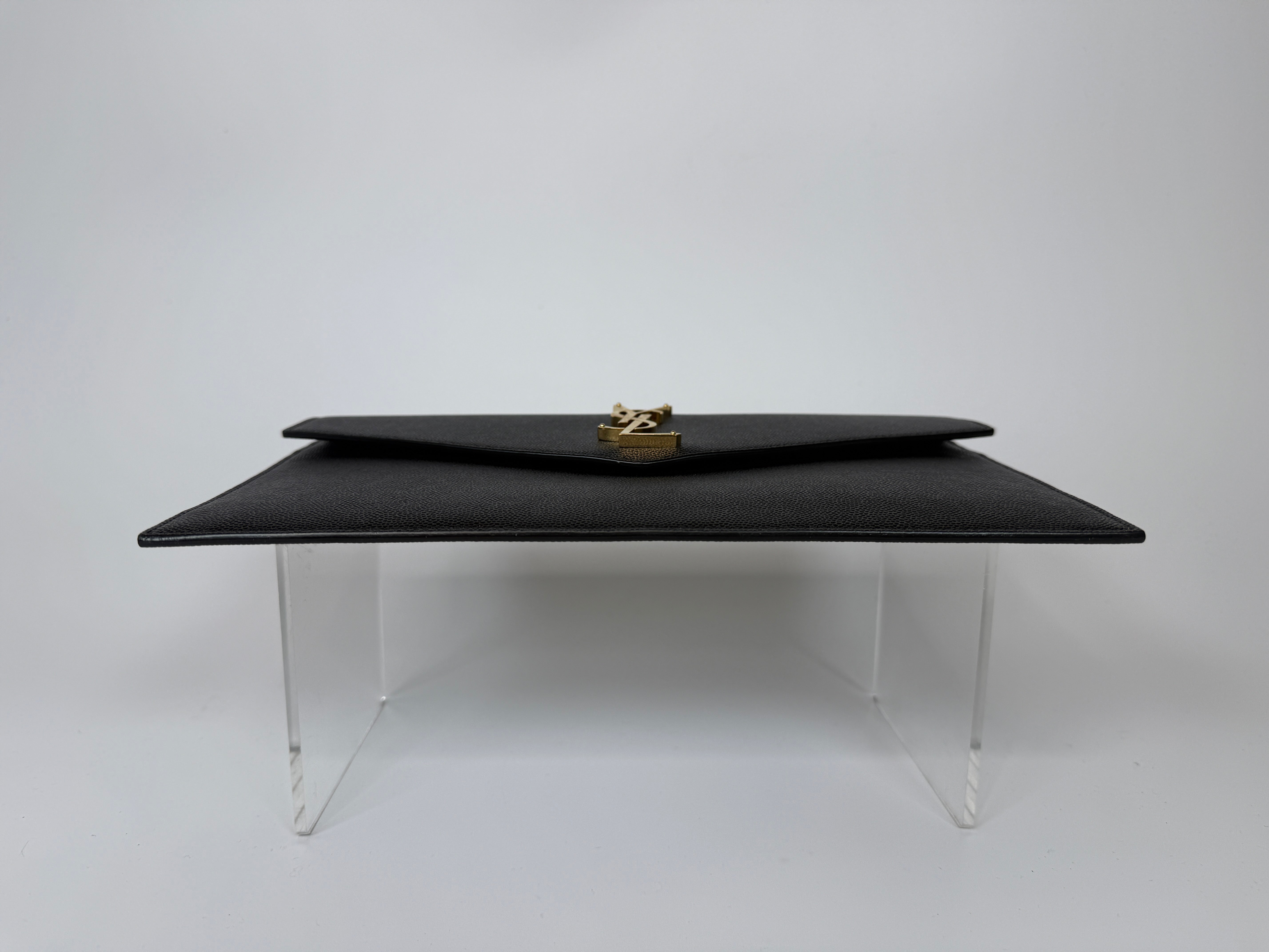 Saint Laurent Uptown Clutch In Black Leather With Gold Hardware. Authentic and preloved, 100% authenticity guarantee