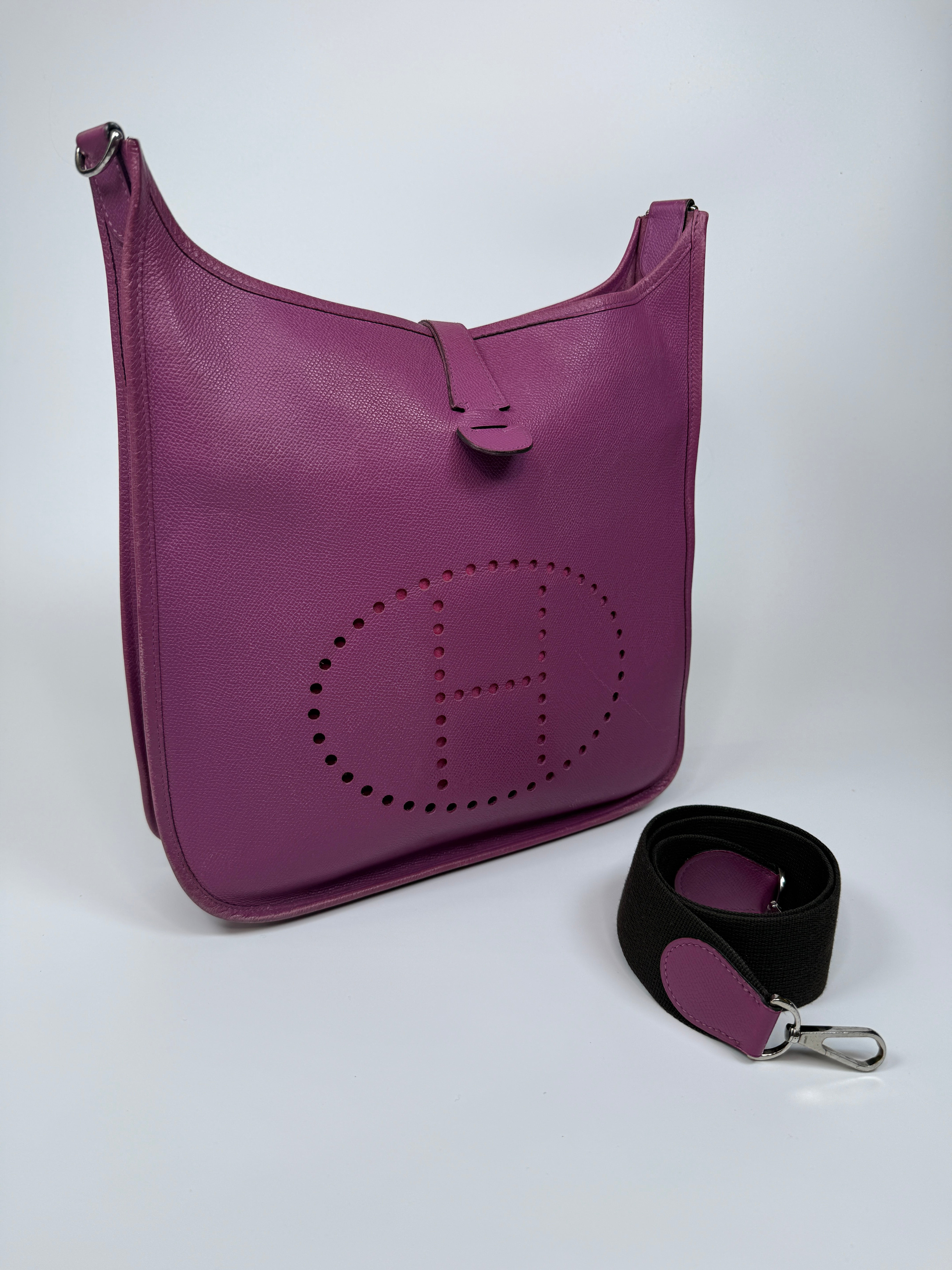 Authentic and preloved Hermès Evelyne 29 In Purple Clemence Leather With Palladium Hardware. Good Condition. 100% Authenticity Guarantee