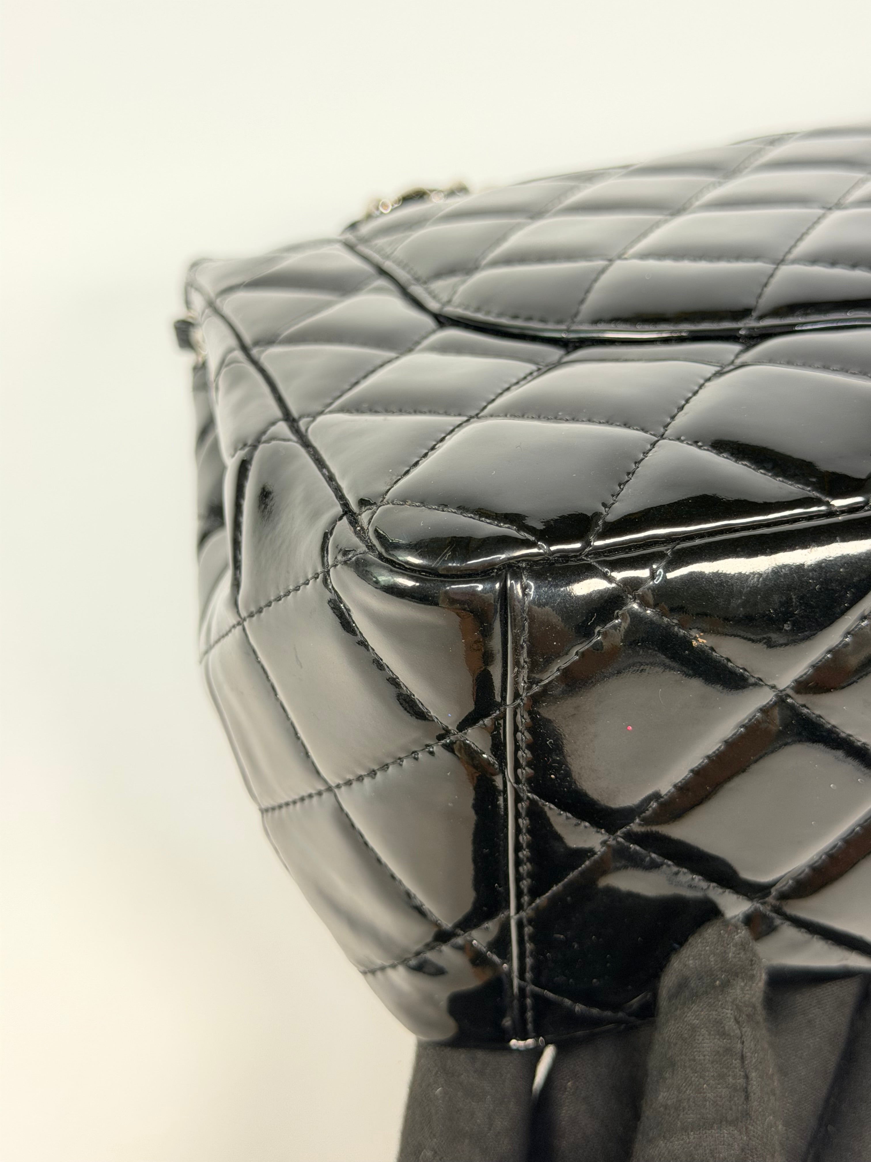 Chanel Maxi Classic Double Flap In Black Patent Leather With Silver Hardware. 100% authentic and preloved in excellent condition.