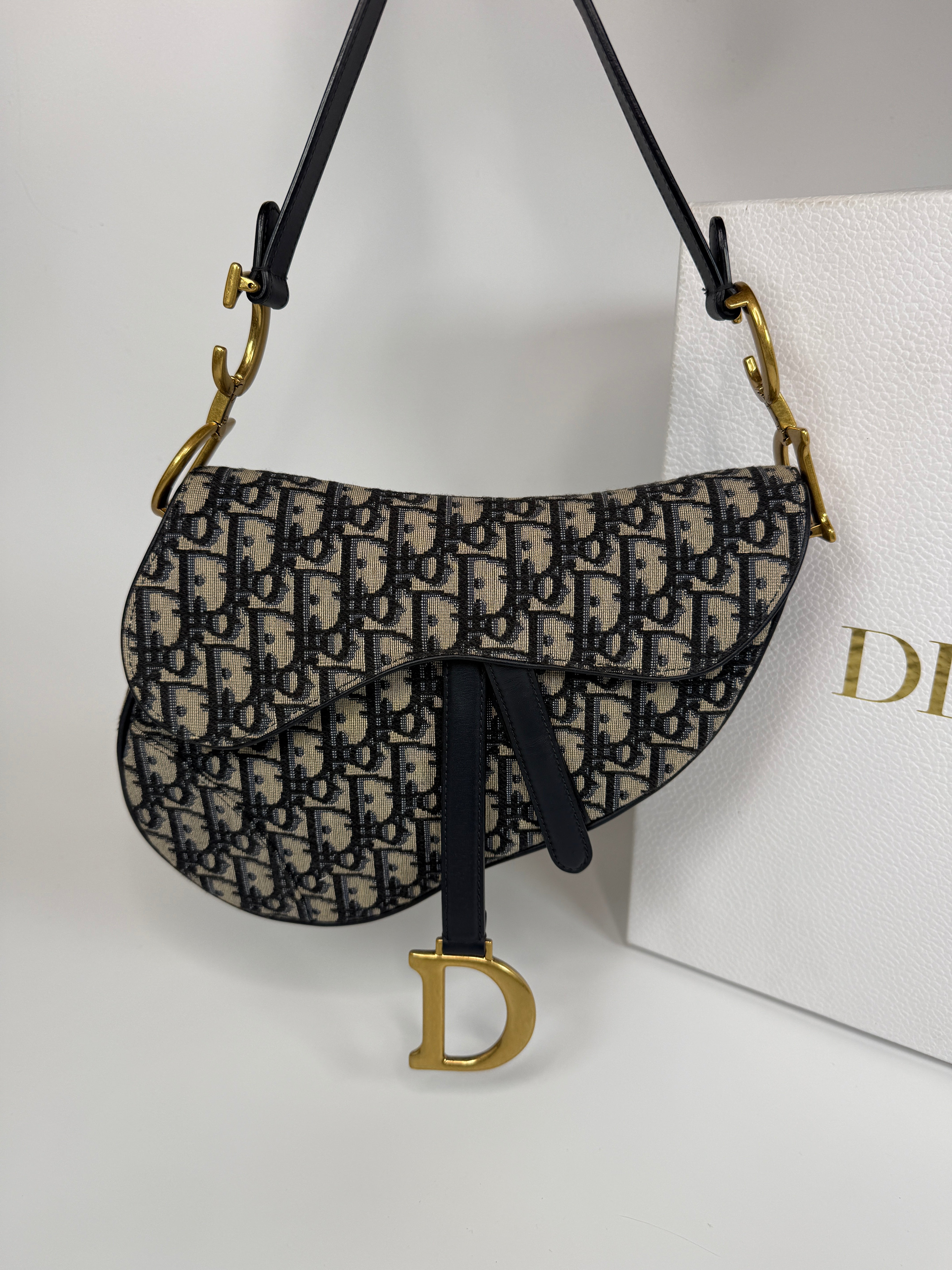 Authentic and preloved Christian Dior Saddle Bag In Oblique Canvas With Gold Hardware. Excellent condition. 100% Authenticity Guarantee