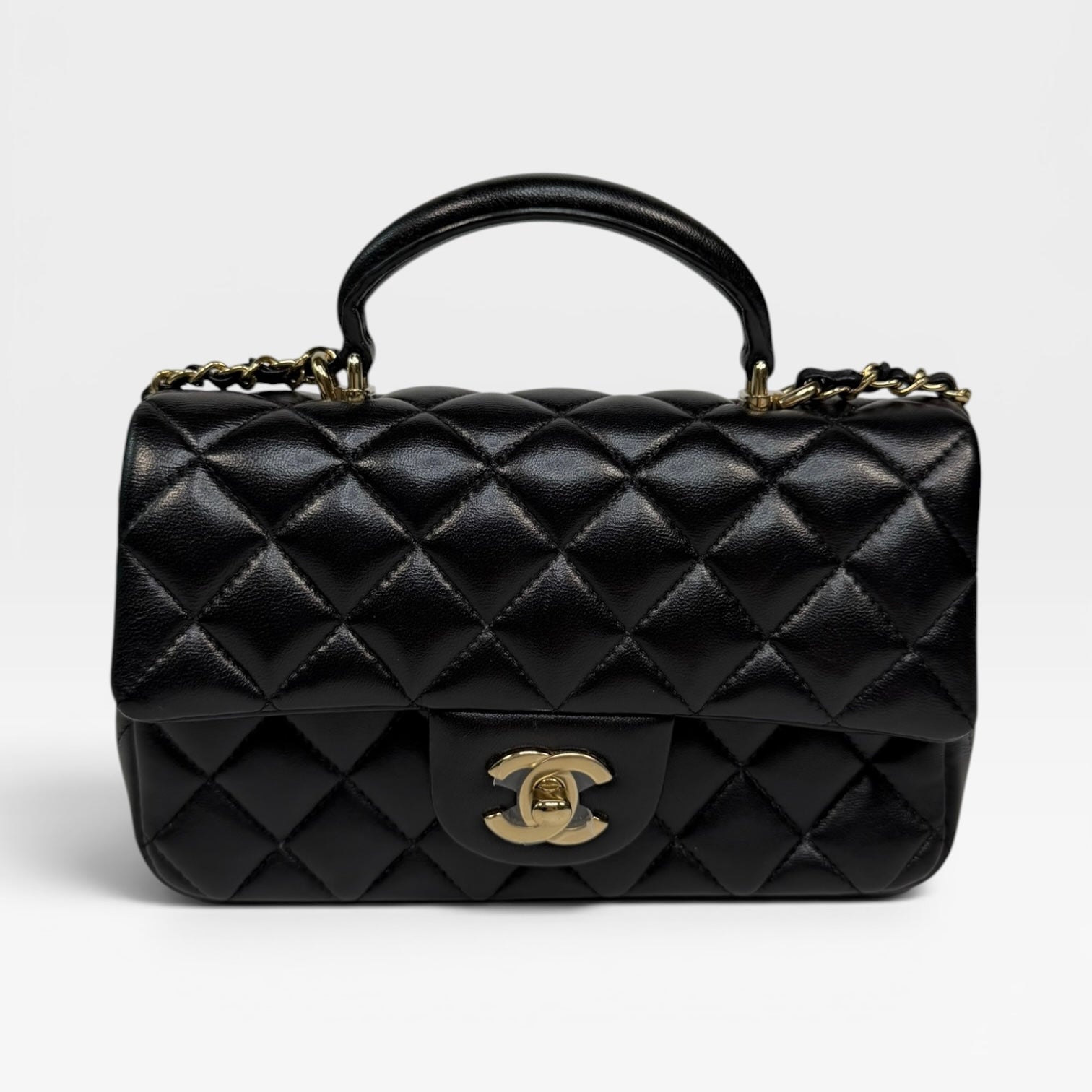 Chanel Mini Rectangle Top Handle In Black Lambskin Leather With Pale Gold Hardware. Authentic and preloved in excellent condition.