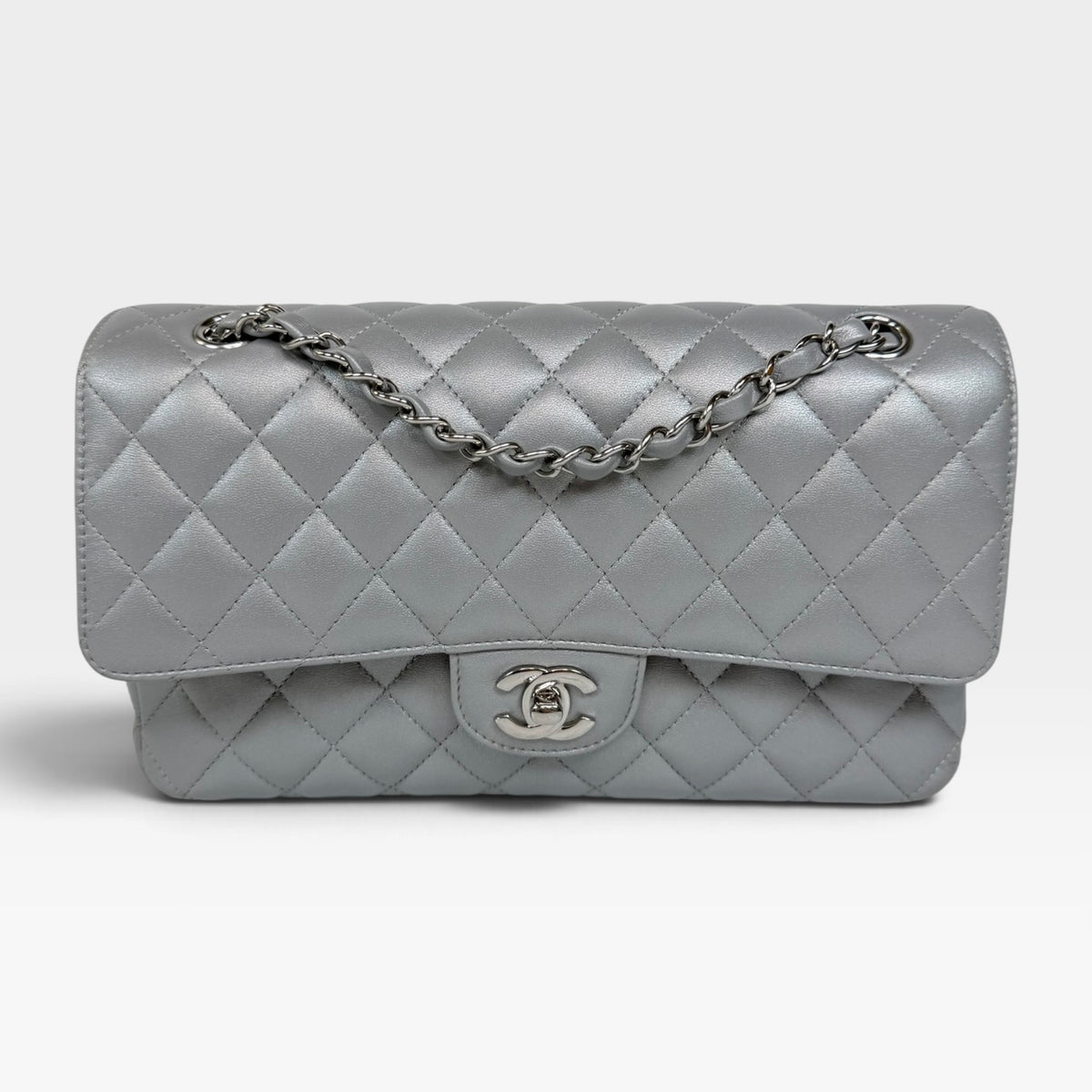 Chanel Medium Classic Double Flap In Silver Lambskin Leather Silver Hardware. 100% authentic and preloved in excellent condition