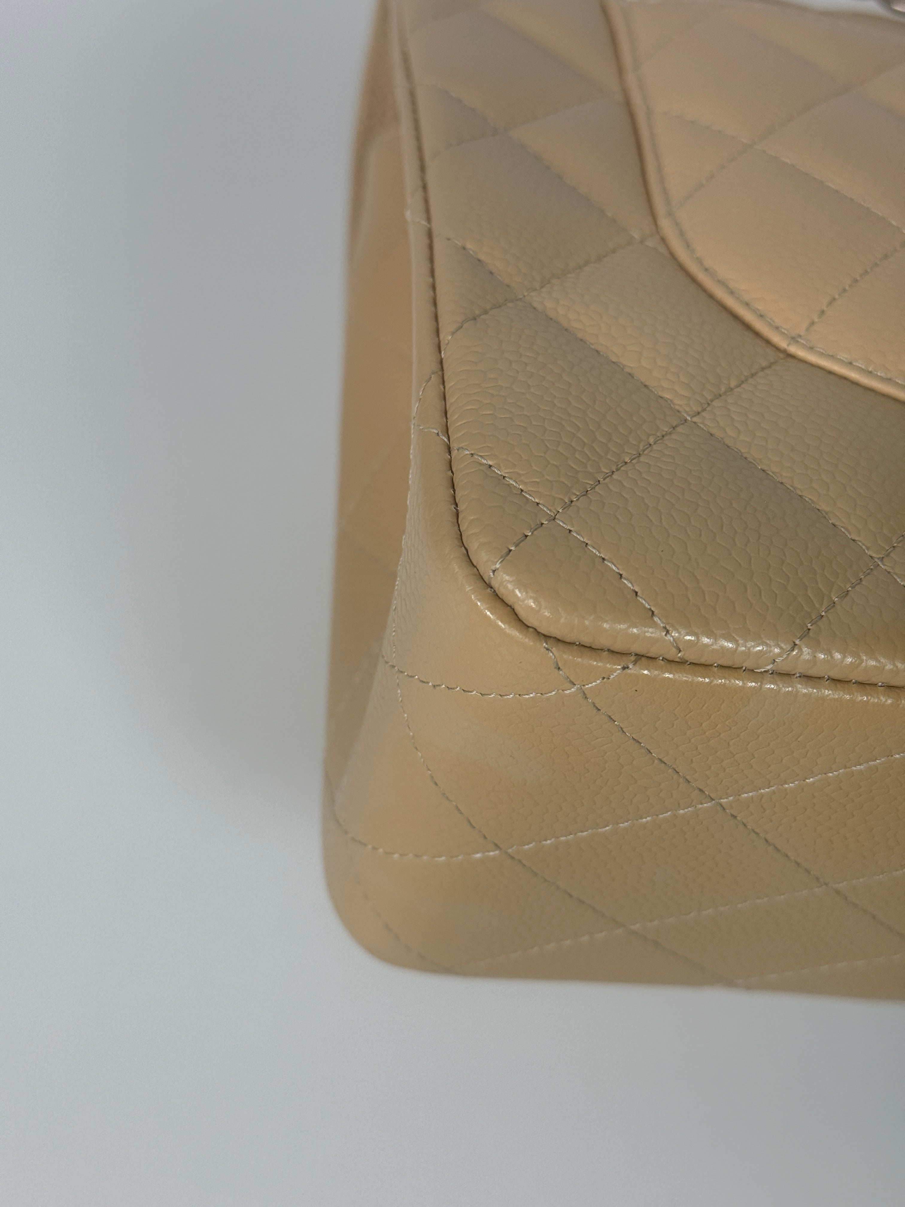 Authentic and preloved Chanel Jumbo Classic Flap Bag In Beige Caviar Leather With Silver Hardware. 100% Authenticity guarantee. Verified by Luxe Cheshire. Fully Insured next day delivery