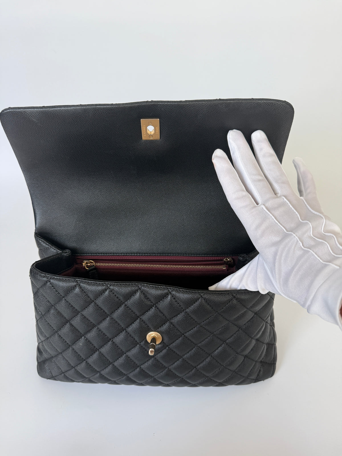 Chanel Coco Large Top Handle In Caviar Leather With Gold Hardware. Verified by Luxe Cheshire. Trusted designer resale.