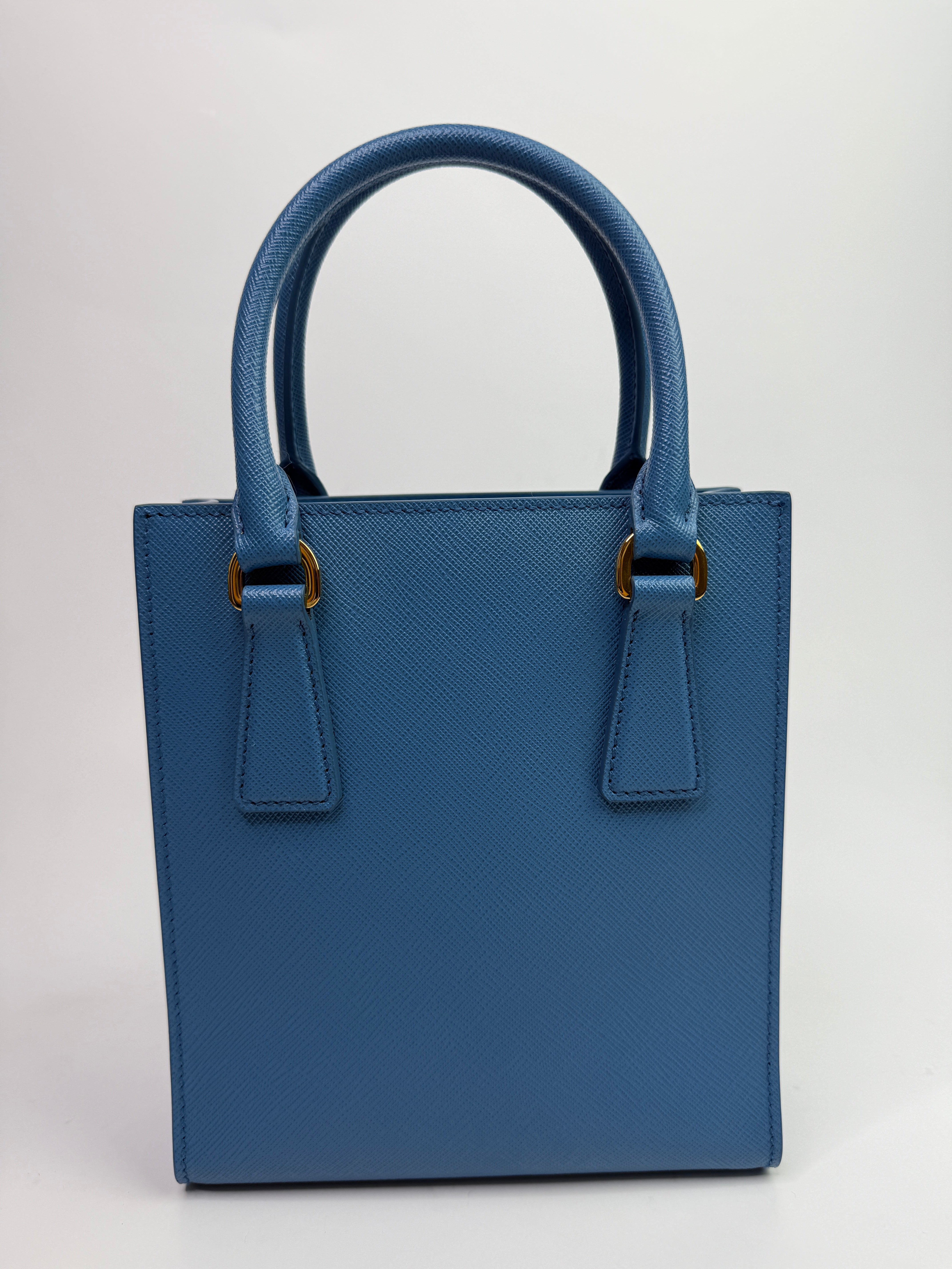 Prada Mini Tote In Powder Blue Saffiano Leather
Authentic Pre Loved Verified by Luxe Cheshire Trusted Designer resale