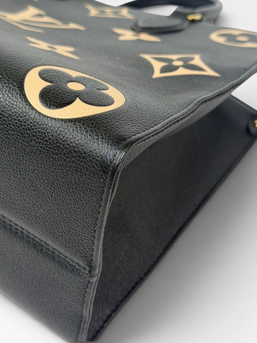Louis Vuitton On The Go MM Tote In Black & Beige Leather With Gold Hardware. 100% authentic and preloved in excellent condition