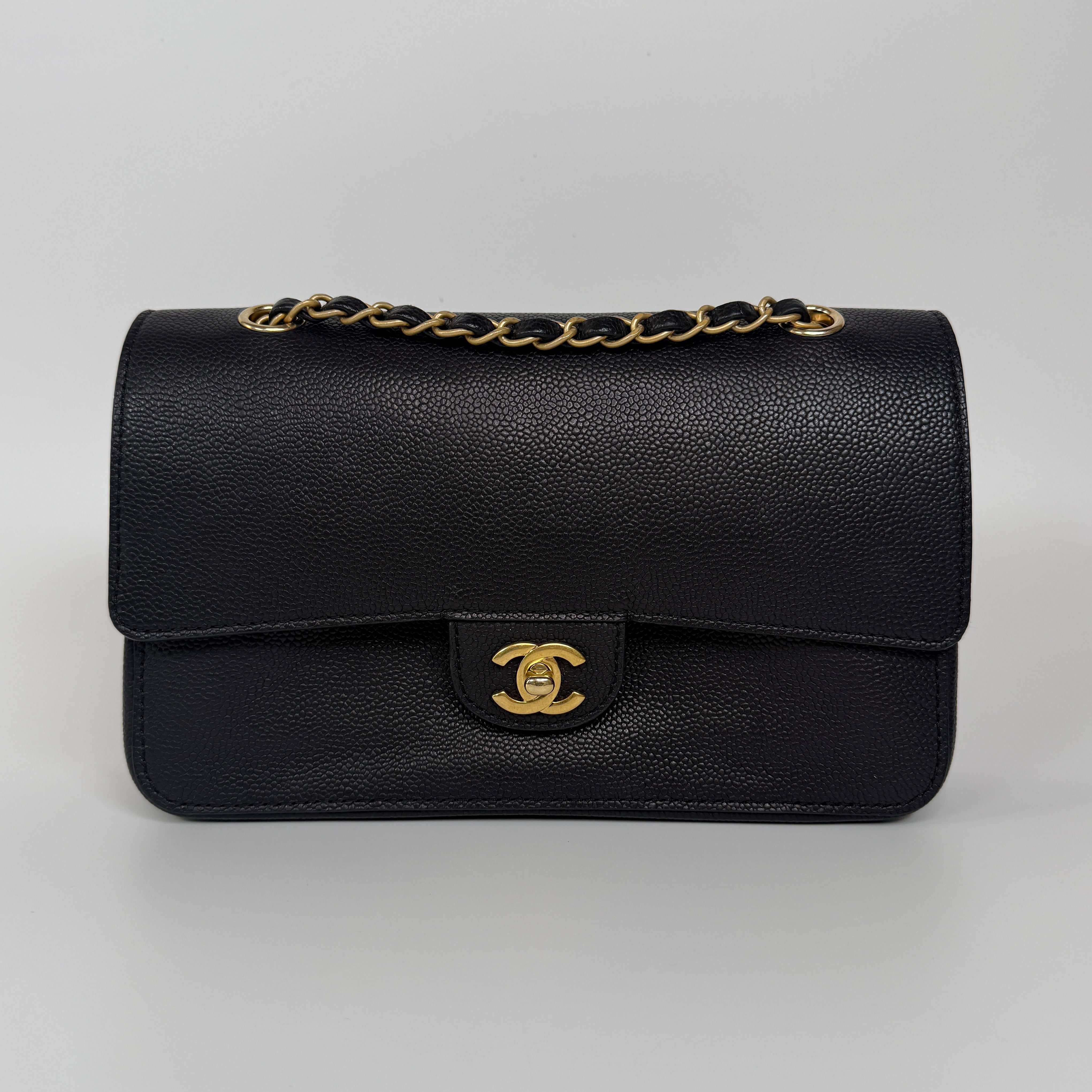 Authentic and preloved Chanel Medium Pure Timeless Flap Black In Black Caviar Leather With Gold Hardware. 100% Authenticity Guarantee