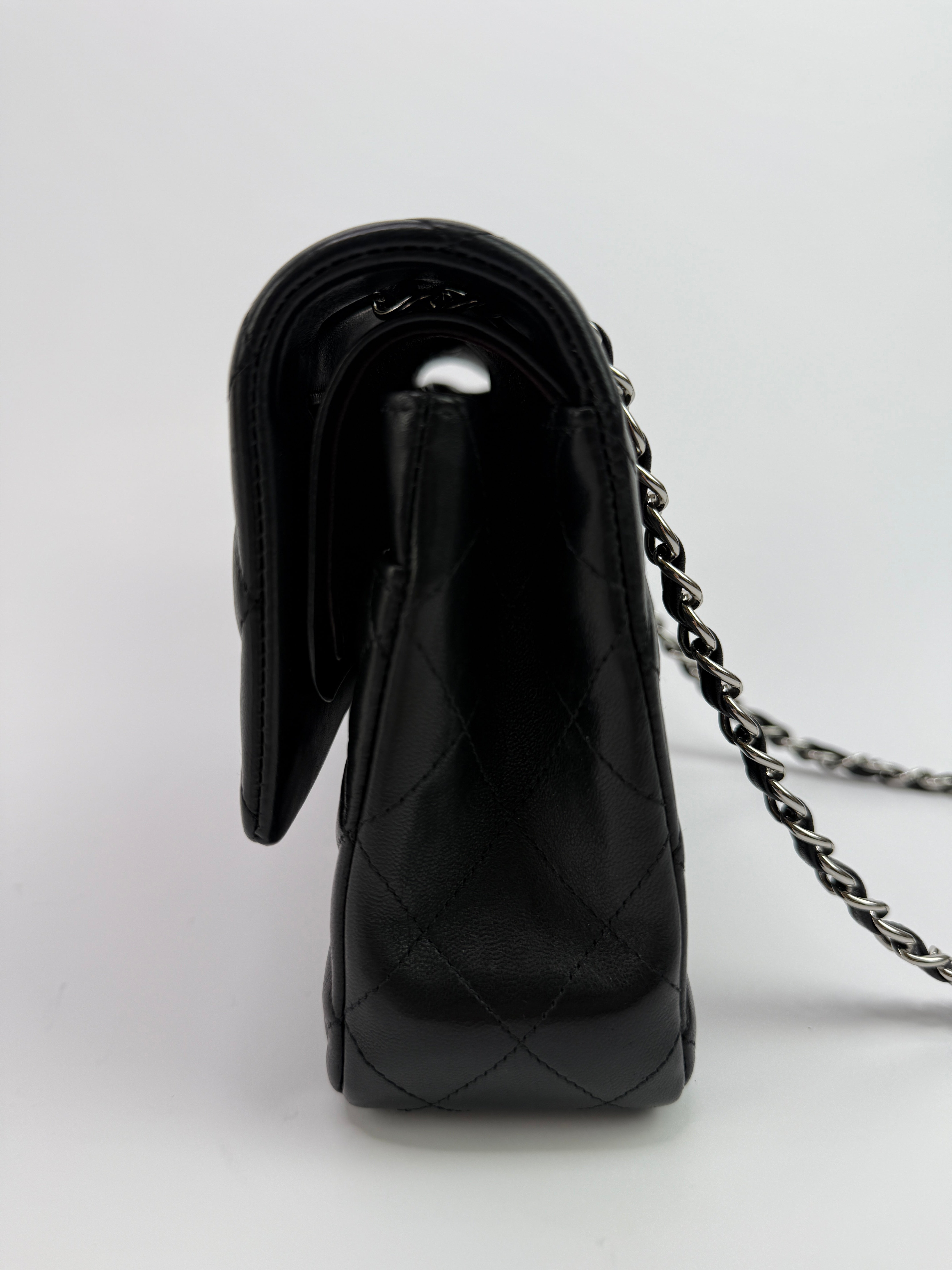 Authentic and preloved Chanel Medium Classic Double Flap Black Lambskin With Silver hardware Excellent condition. 100% Authenticity guarantee