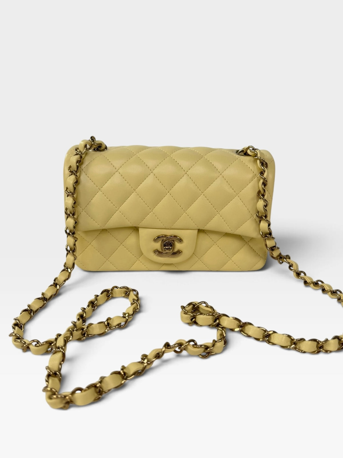 Chanel Mini Rectangle In Yellow Lambskin Leather With Gold Hardware. 100% authentic and preloved in excellent condition