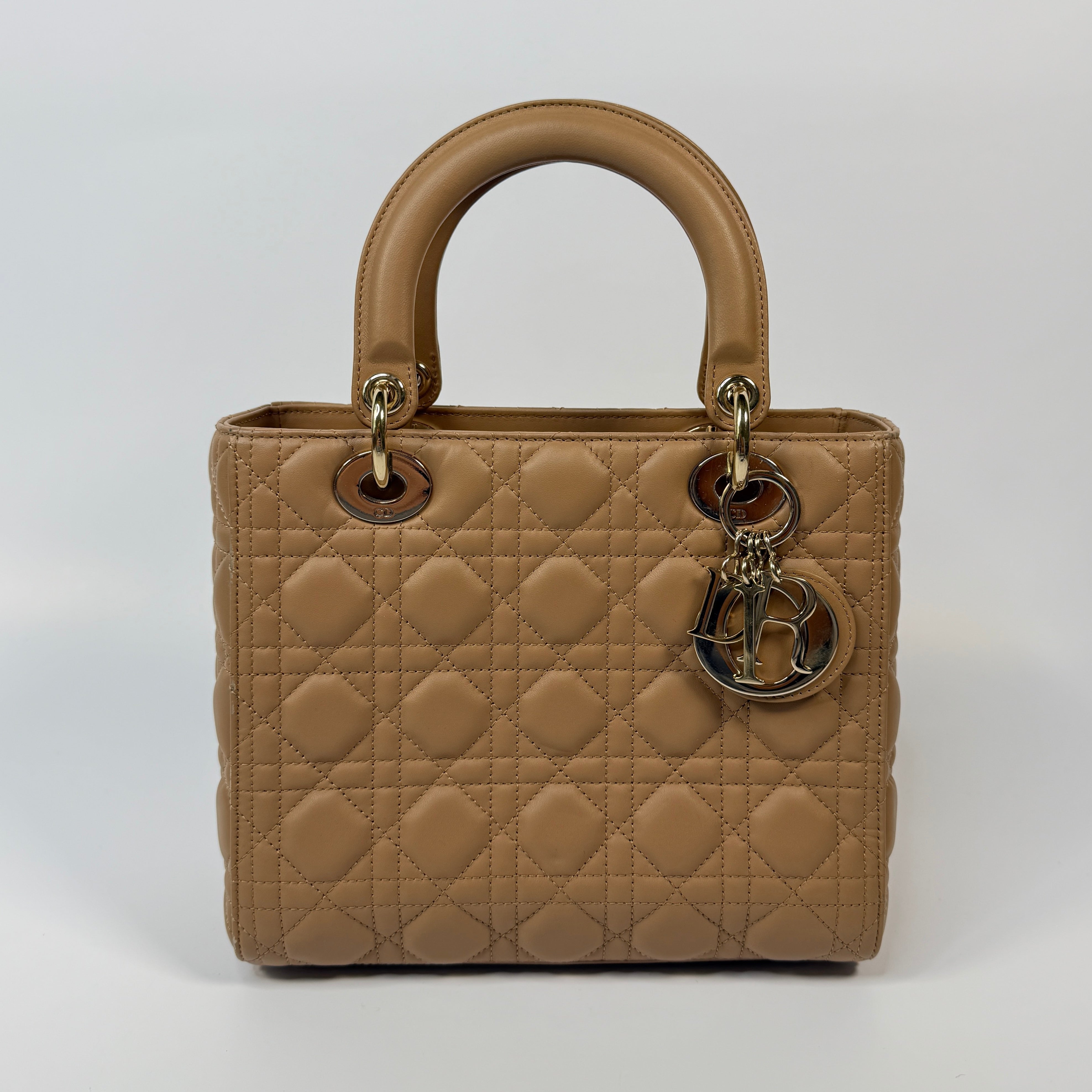 Authentic pre-loved Christian Dior Medium Lady Dior Bag in gold with gold hardware