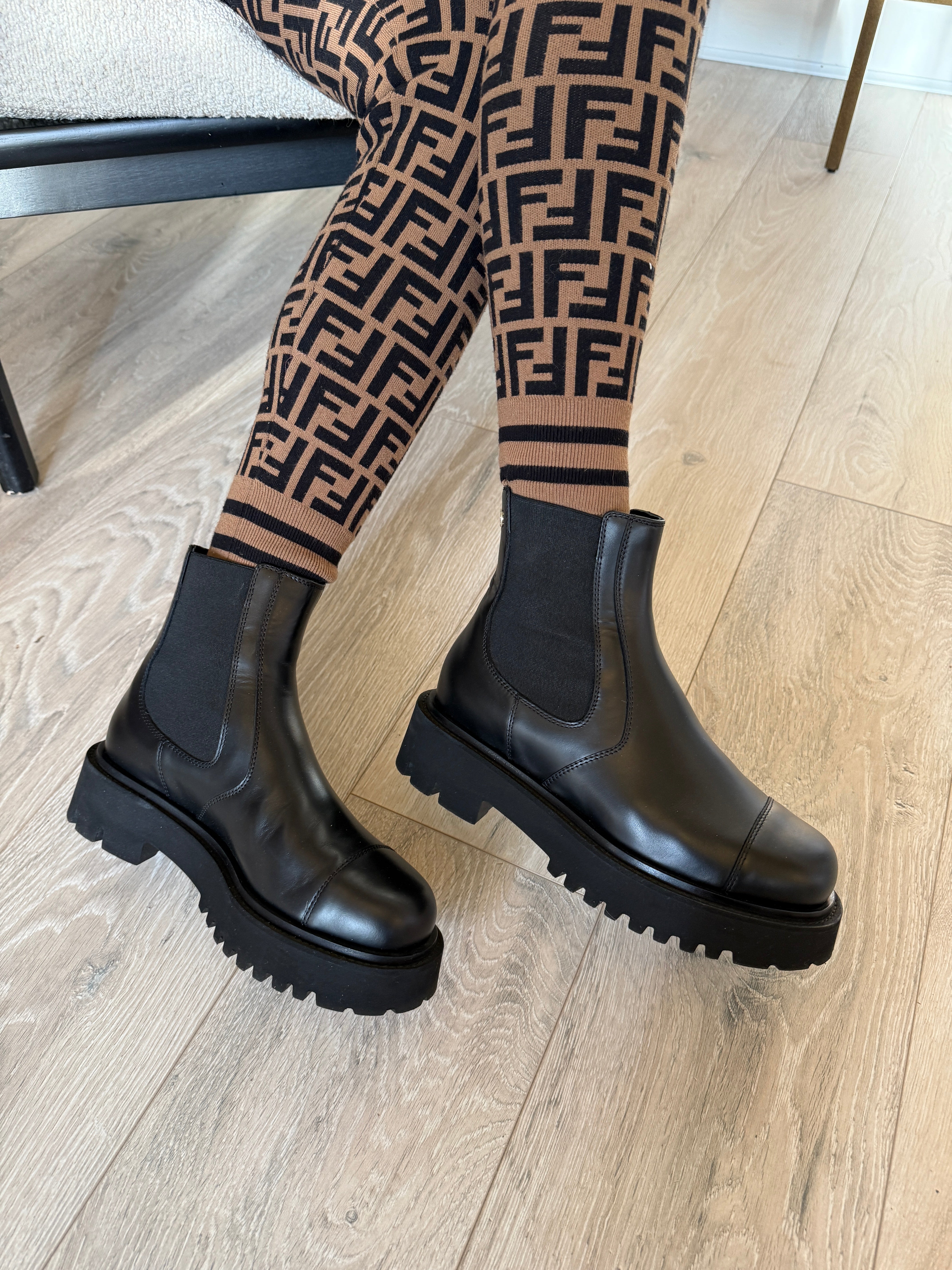 Chanel CC Boots (Size 38/UK5) in black leather. Excellent condition. Authentic and preloved