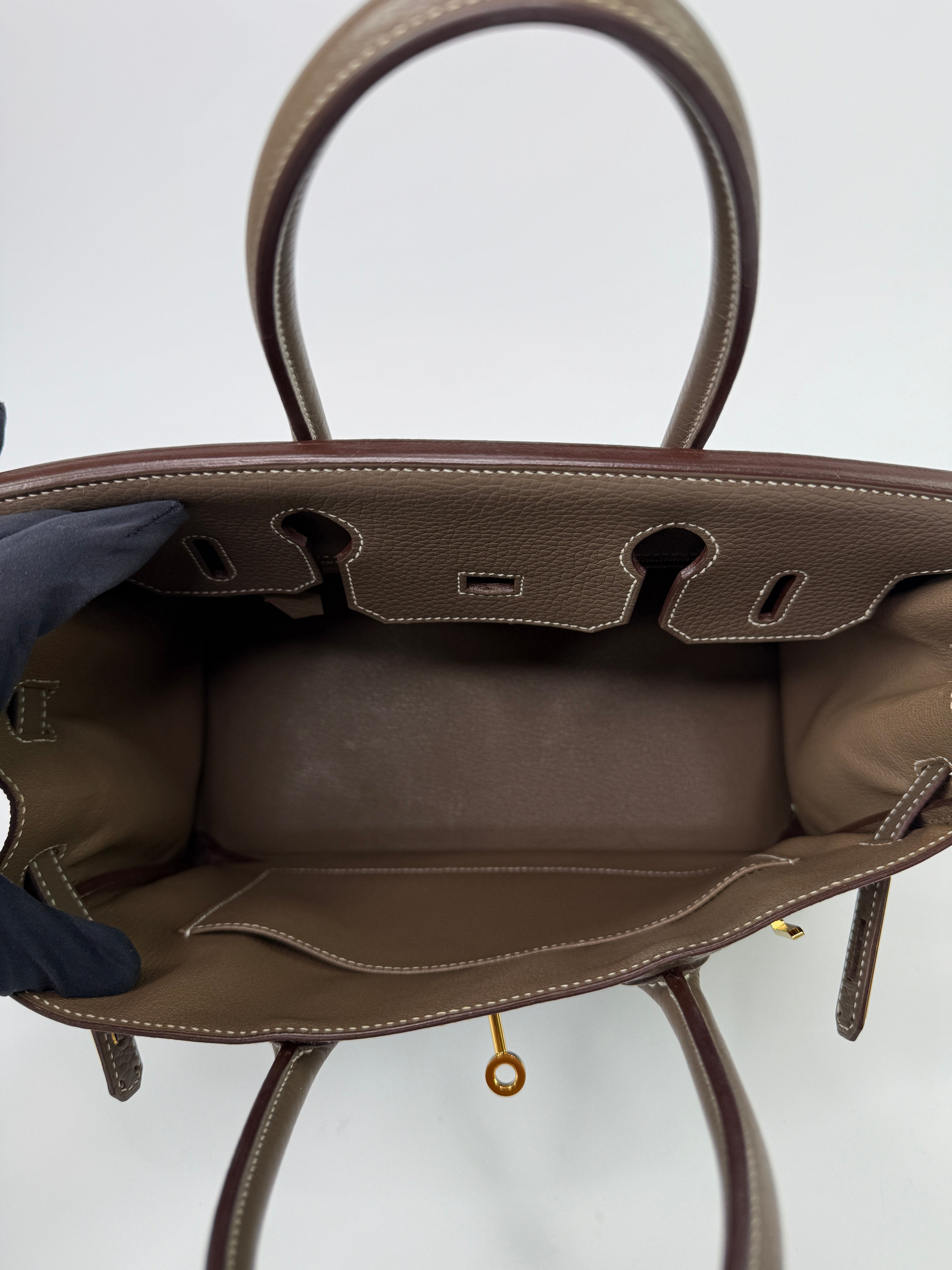 Authentic pre-loved Hermès Birkin 30 In Etoupe Togo Leather With Gold Hardware.